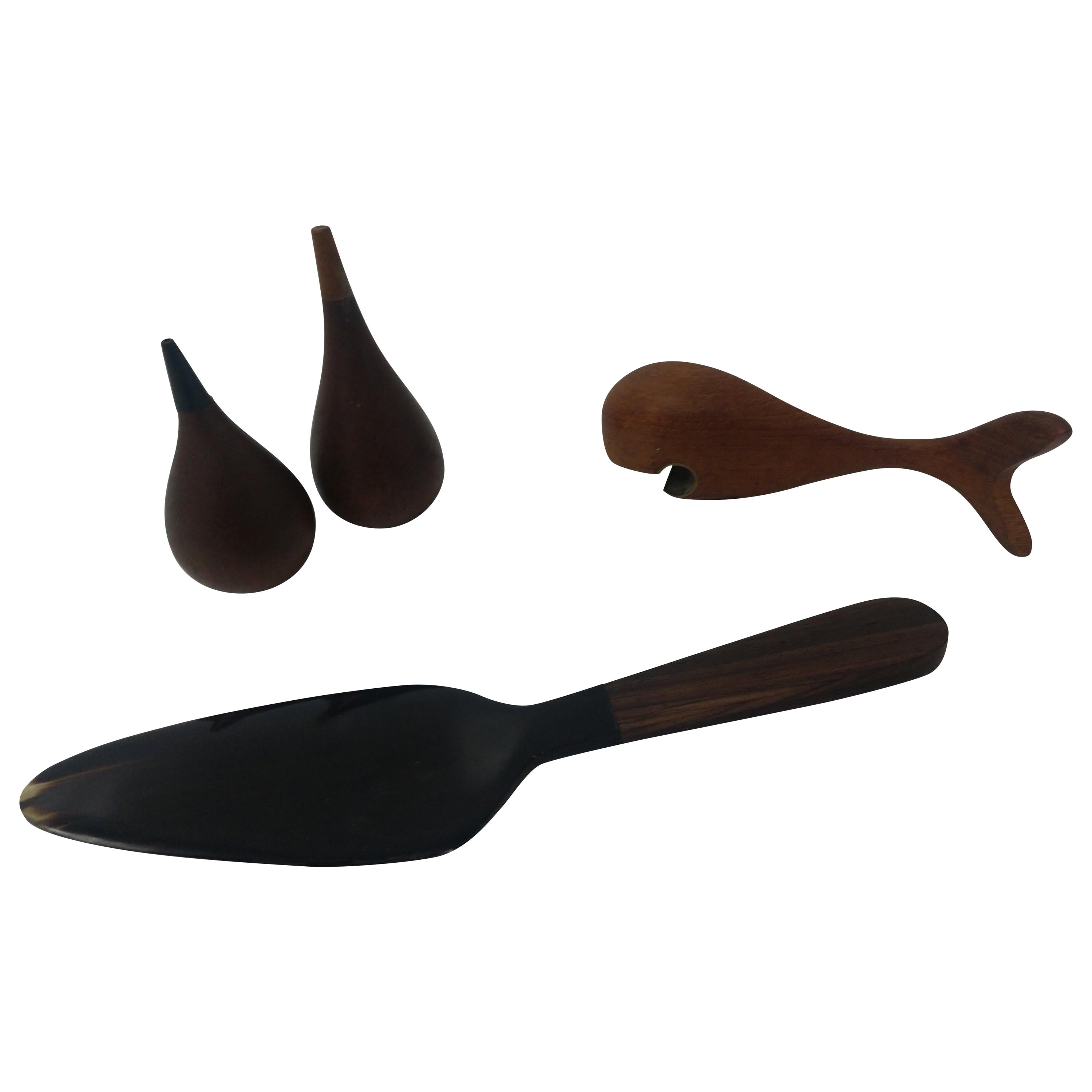 Carved whale bottle opener (sold)made from teak with brass as the opener. Salt and pepper is (Sold)teak also with weighed metal bottoms for stability. Cake server is available and has a black walnut handle with faux Horn server. Server is 10.5 x 2.5