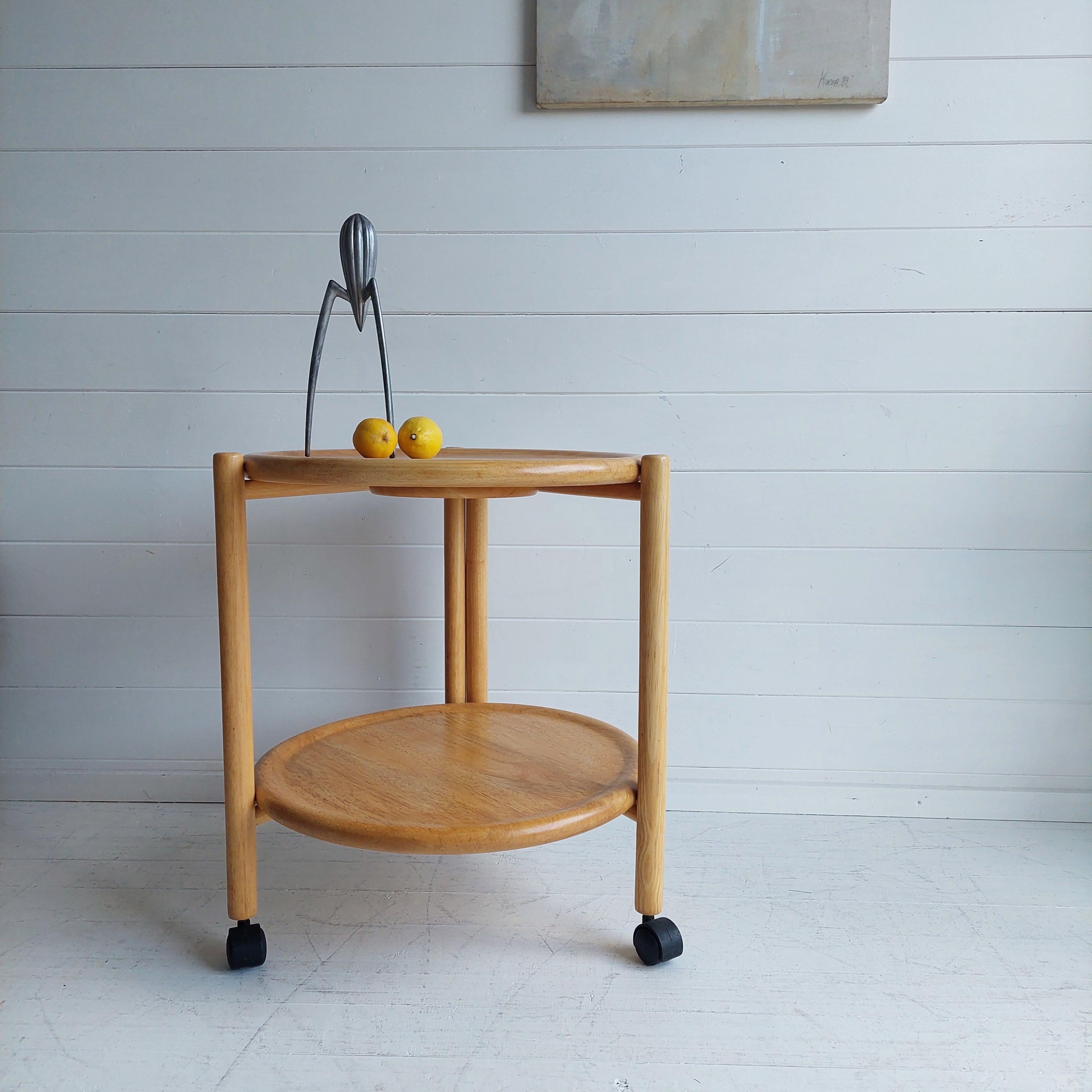 Wooden Lazy Susan trolley foldable

A great piece of Danish furniture that is stylish, practical and functional. 
This a trolley made from Beech Wood complete with wheels. 
This is ideal for entertaining, what makes it extra special is that it