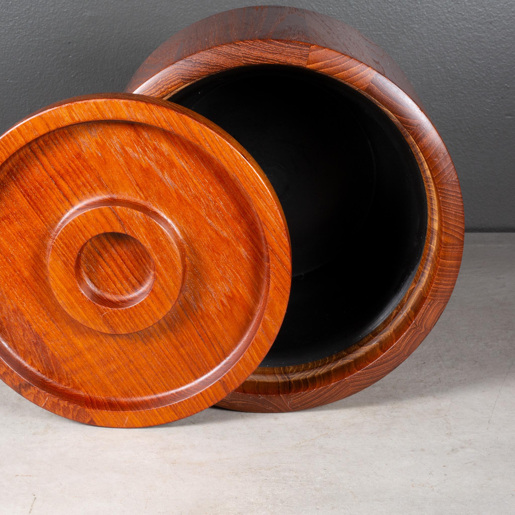 ABOUT

An original mid-century Teak round ice bucket with black, plastic insert. Impressed stamp on the bottom with maker's mark.

    CREATOR Dansk International Design Ltd, Malaysia.
    DATE OF MANUFACTURE c.1950-1960.
    MATERIALS AND