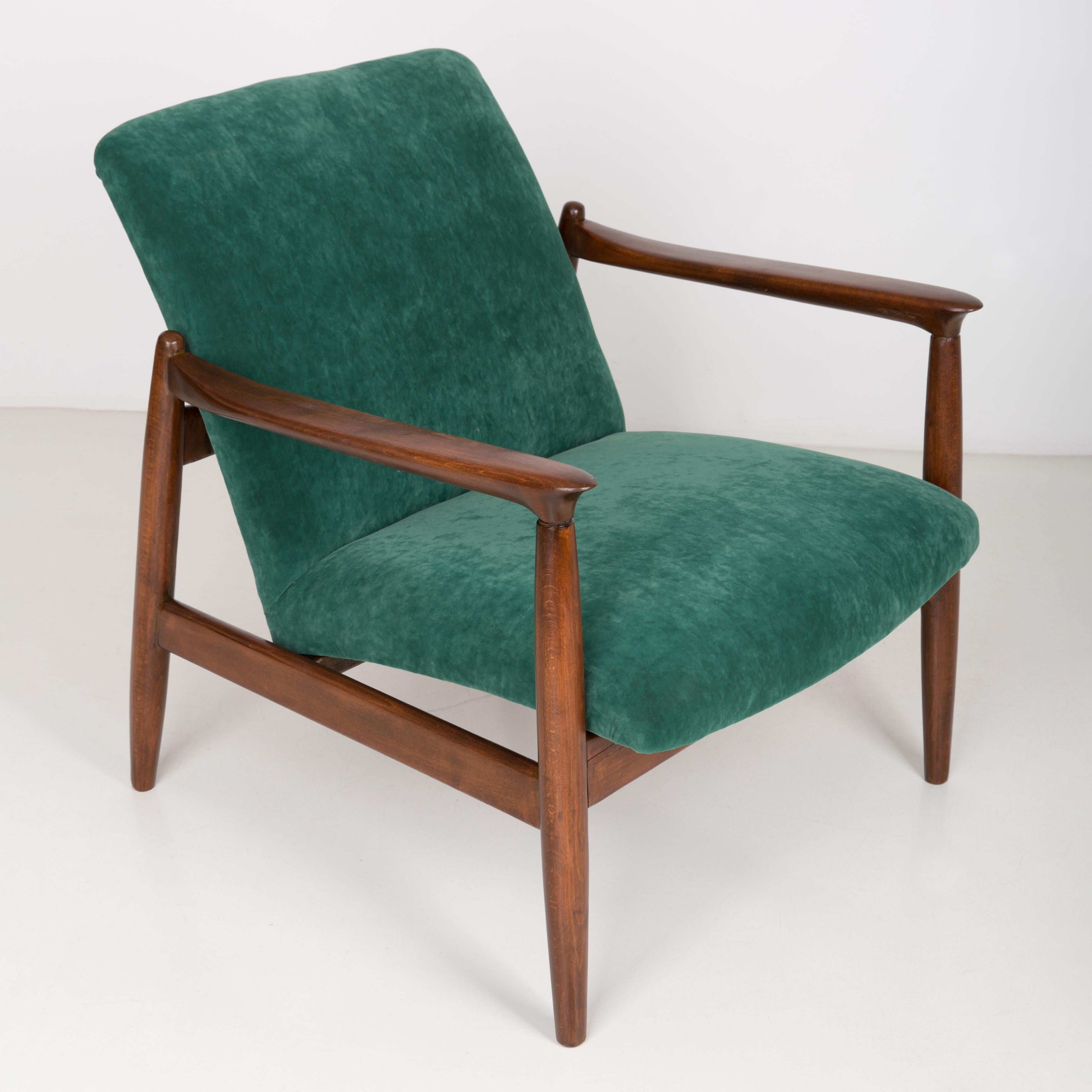 Beautiful Vintage Green Armchair, designed by Edmund Homa. 
The armchair was made in the 1960s in the Gosciecinska Furniture Factory. They are made from solid beechwood. The GFM type armchair is regarded one of the best polish armchair design from