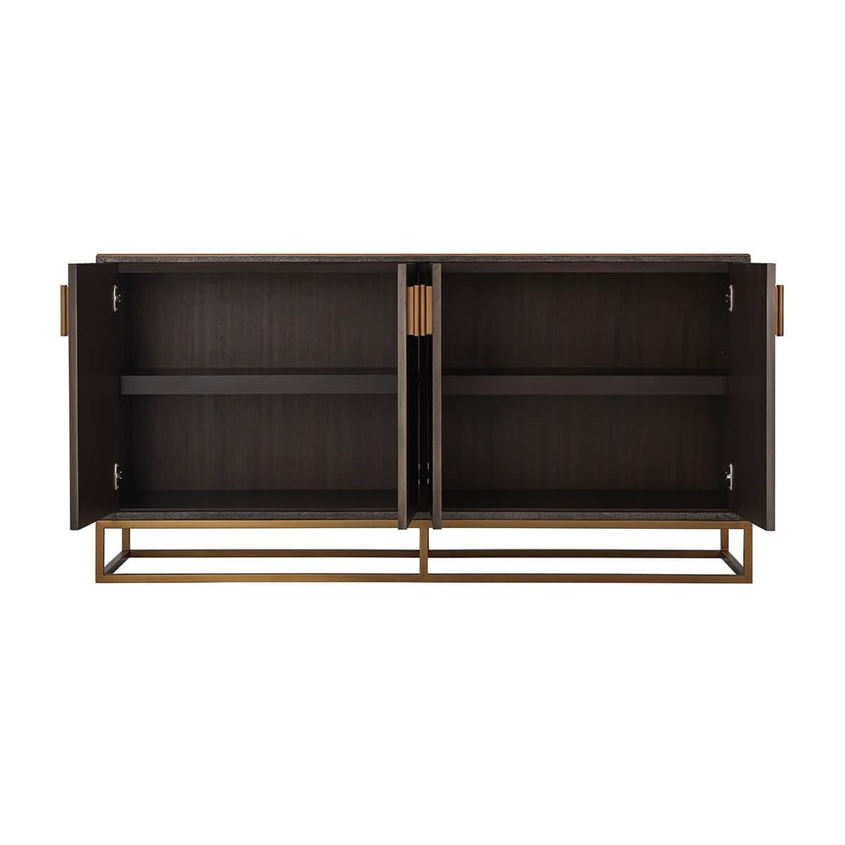 A leather wrapped case, in our dark tempest finish, with four doors, enclosing interior shelves. Having brush brass finished hardware and an open cubed base frame.

Dimensions: 63