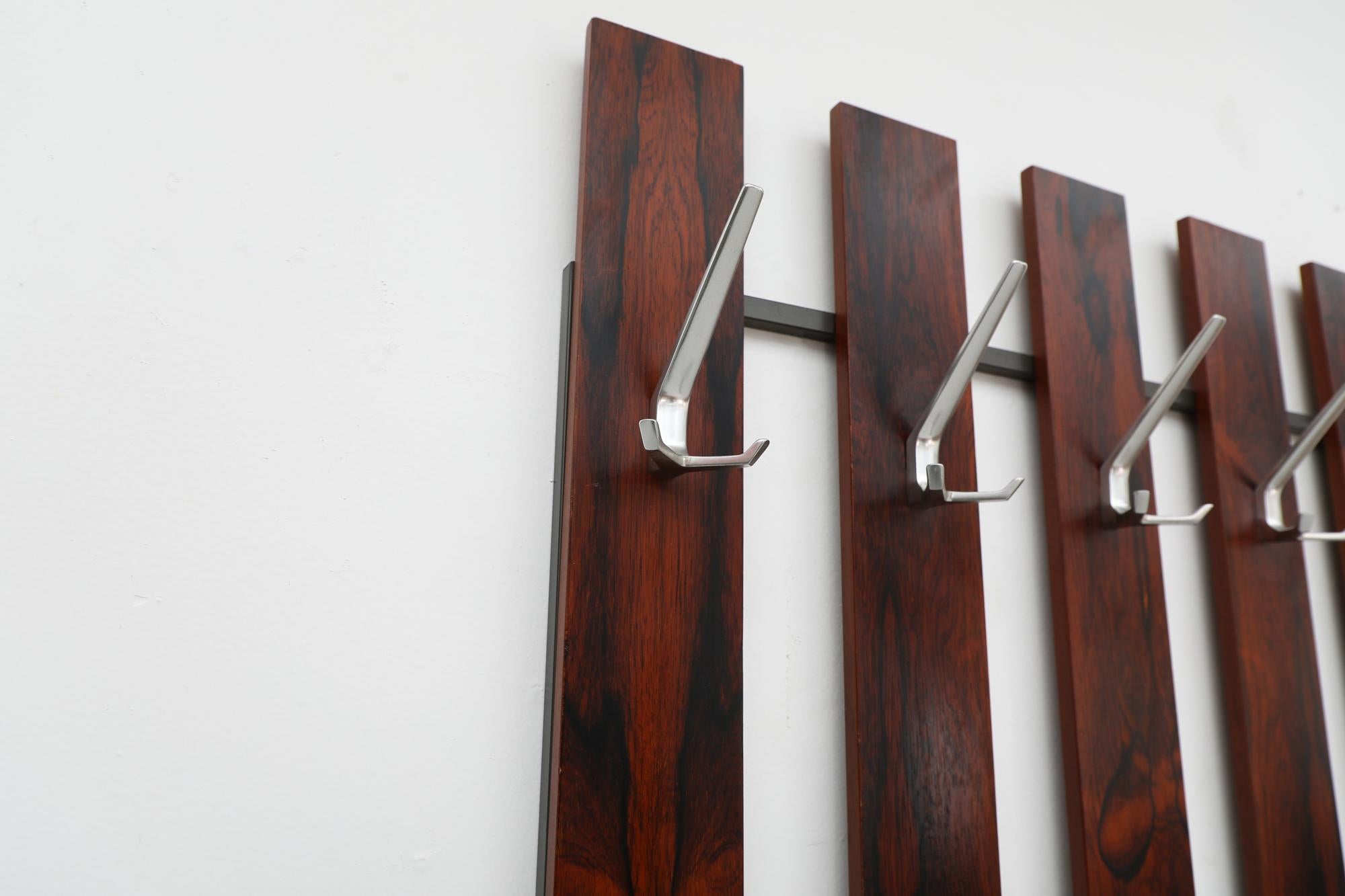 Large Mid-Century Dark Rosewood Wall Mounted Coat Rack with Metal Hooks In Good Condition For Sale In Los Angeles, CA