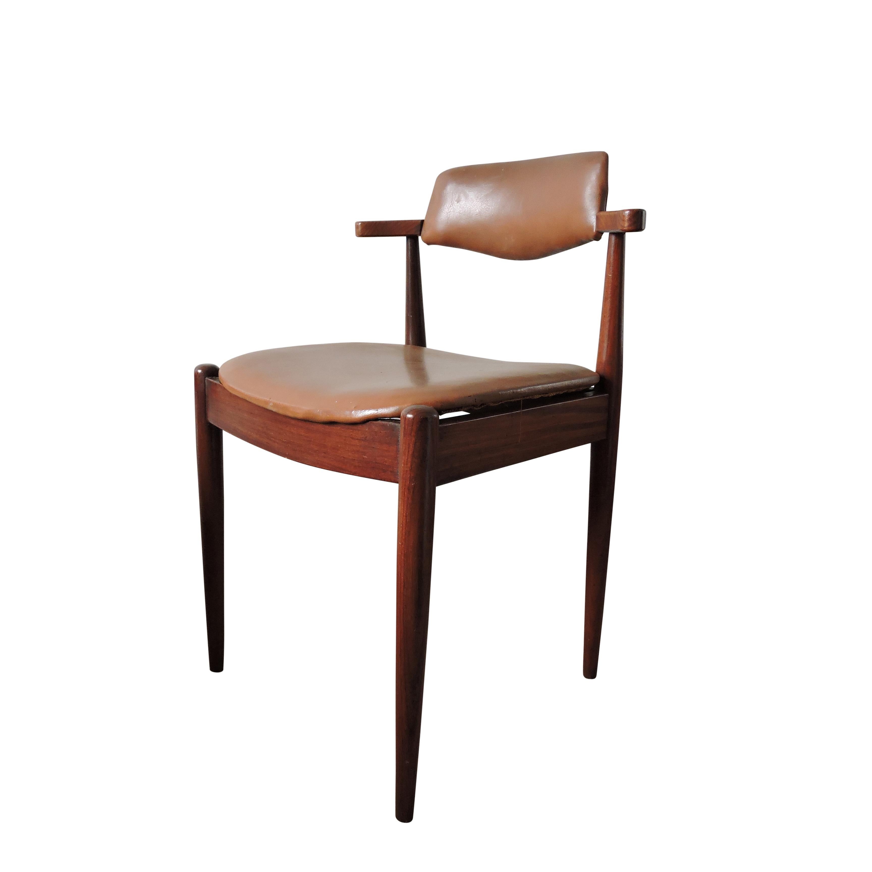 Set of 3 dark teak and faux leather brown dining chairs. The chairs feature tapered legs and short arms.