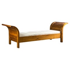Mid-Century daybed in sculpured curved wood, 1950s
