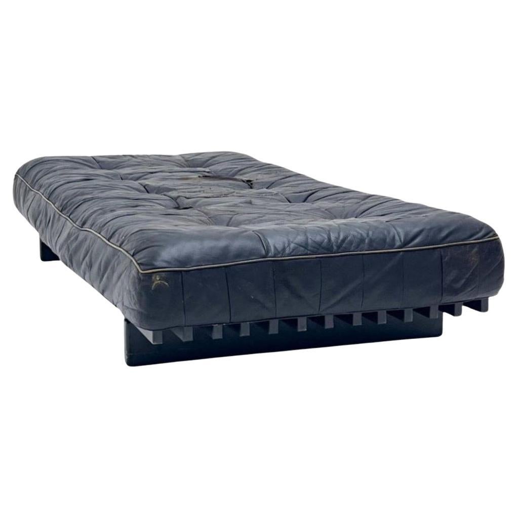 Mid century De Sede Ds80 black patchwork Leather daybed made in Switzerland 1970s. Very High quality thick patchwork Leather. Very low daybed with hardwood black lacquer slatted base. Amazing simple minimalist design. Lots of wear use and patina
