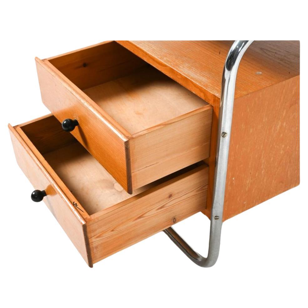 Mid century Deco Bauhaus chrome 2 drawer oak nightstand. Has black ball pulls with 2 drawers. Bent chrome tube structure. Good vintage condition. Located in Brooklyn NYC.

Dimensions H 22