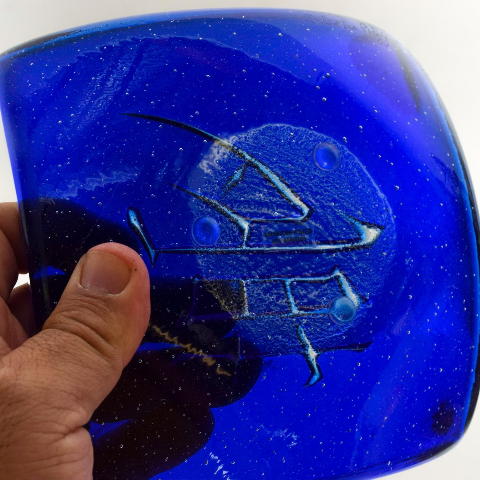 We are pleased to offer for your consideration a midcentury decorative blue glass dish signed by Salvatore Polizzi lovely blue midcentury glass. Los Angeles. Dimensions: 6