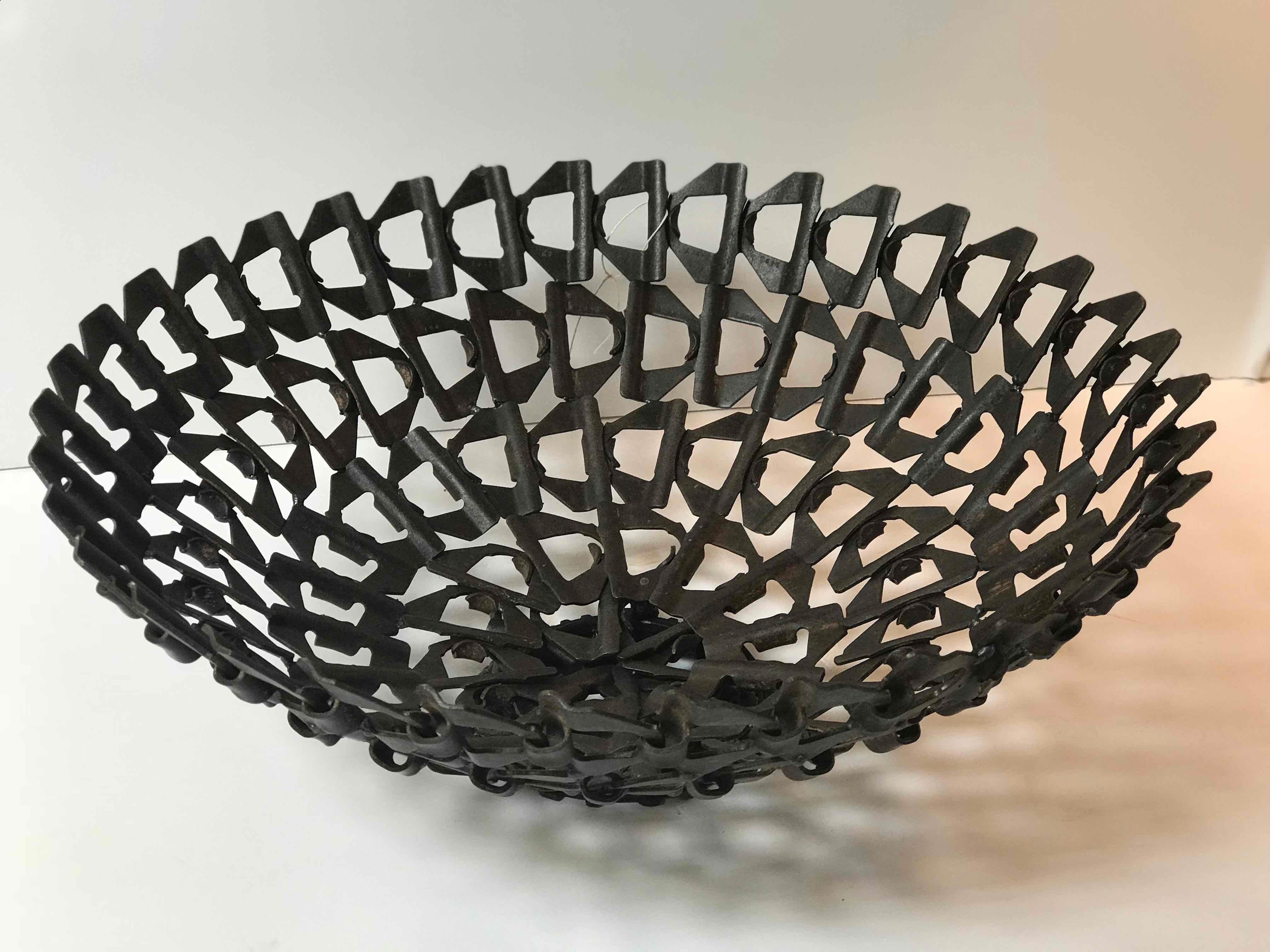 Mid-century decorative bowl made from repurposed iron conveyor belt. 