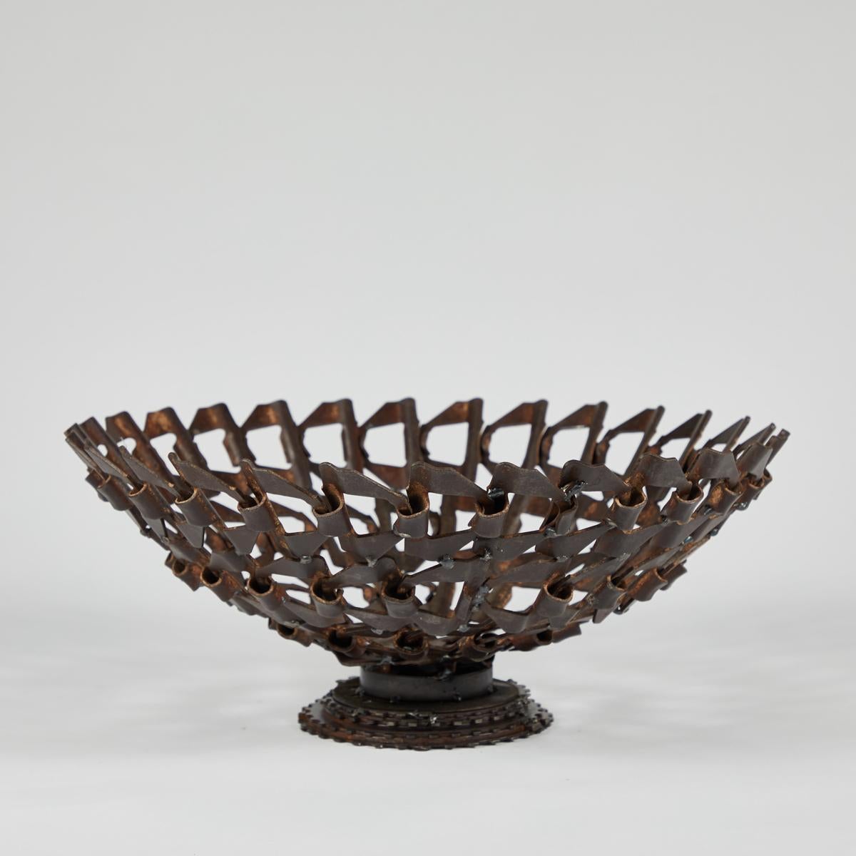 Midcentury decorative bowl made from repurposed iron conveyor belt.