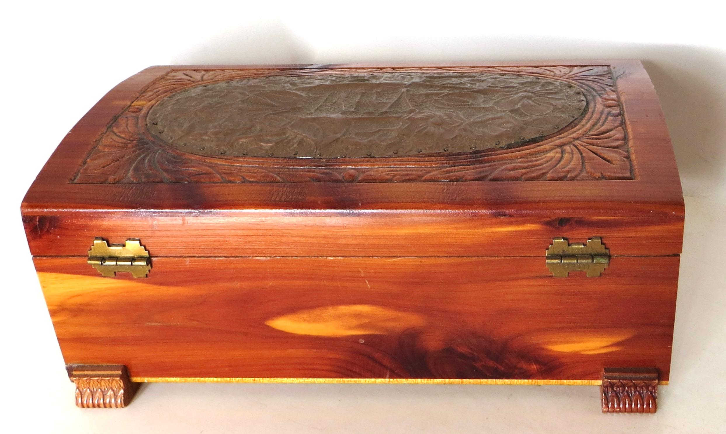 Resting on four paw feet and opening via two rear butterfly hinges, this attractive carved box is featured on top with an oval highly carved applique cartouche, monogrammed with the letters 