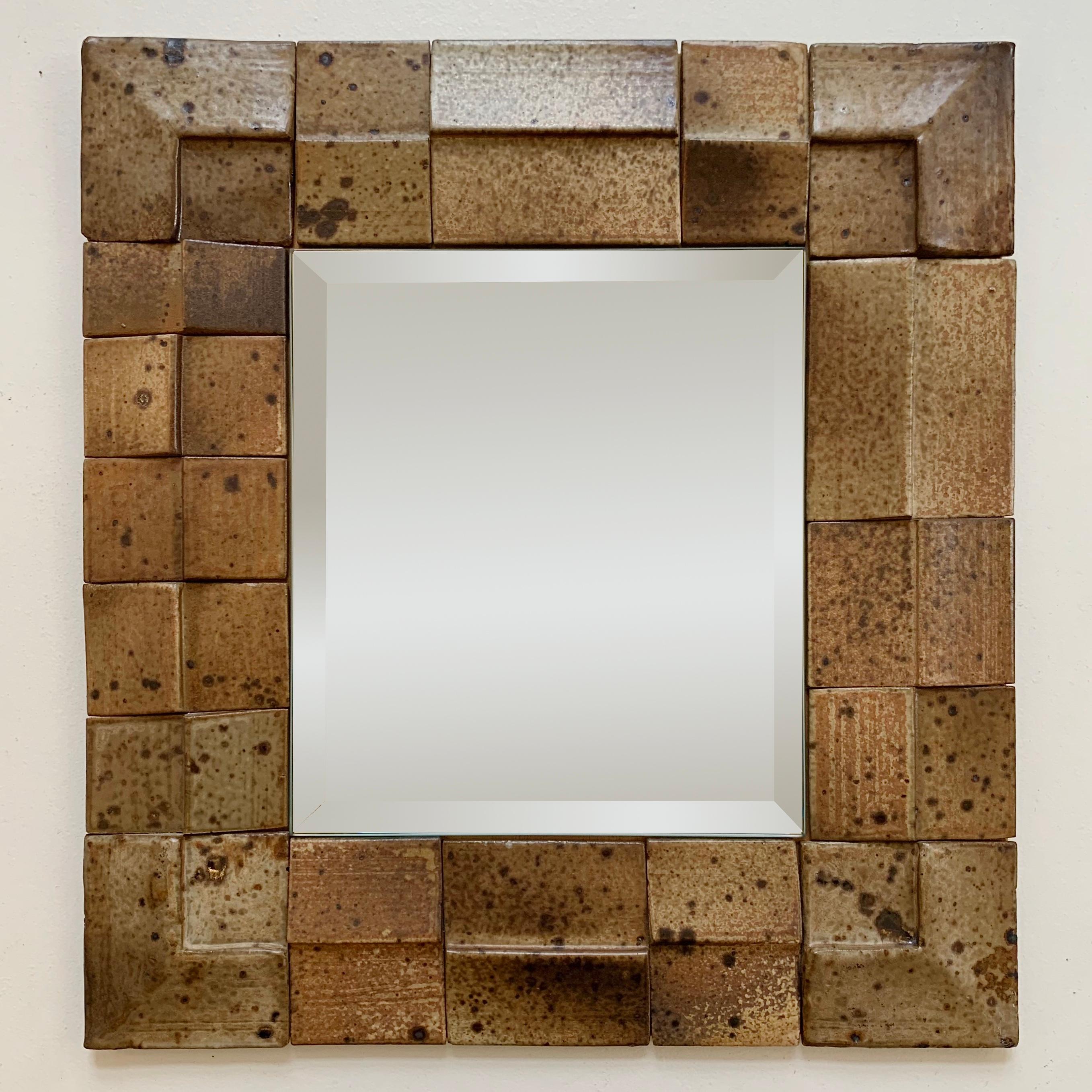 Nice Midcentury decorative ceramic wall mirror.
Brown sandsone elements on wood.
Beveled mirror.
France circa 1970
Dimensions: 35 cm H, 33 cm W, 2 cm D.
All purchases are covered by our Buyer Protection Guarantee.
This item can be returned