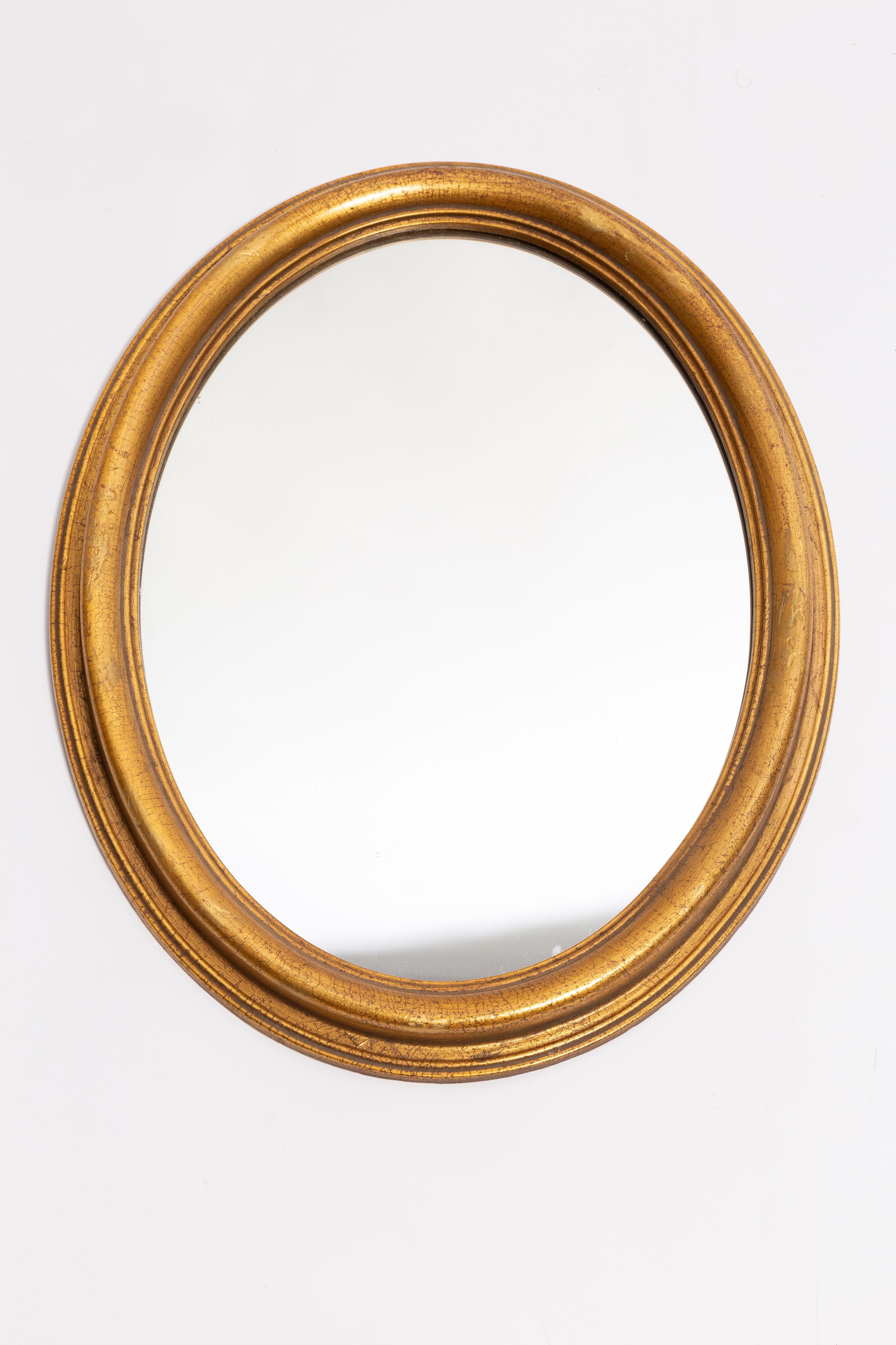 A beautiful big oval mirror in a golden decorative frame from Italy. The frame is made of wood. Mirror is in very good vintage condition - no damage or cracks in the frame. Original glass. Really unique piece for every interior! Only one piece is