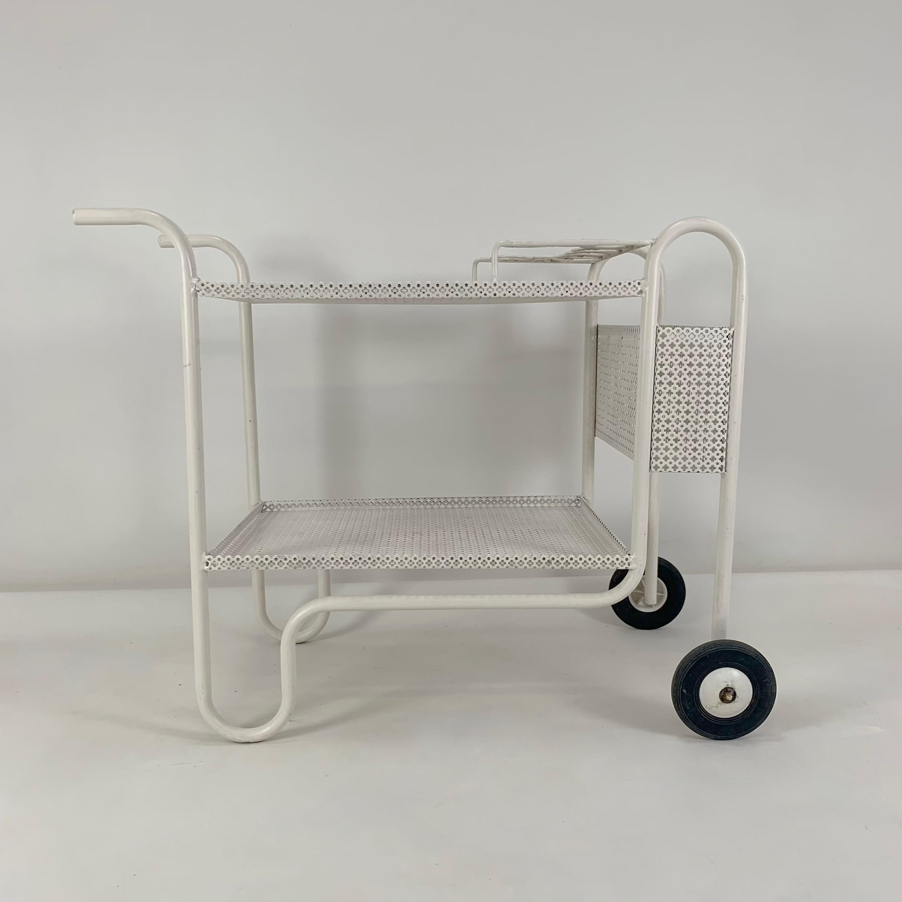 Decorative mid-century bar cart, circa 1950, France.
White perforated metal. Nice model.
Dimensions: 95 cm W, 76 cm H, 50 cm D.
Original condition.
All purchases are covered by our Buyer Protection Guarantee.
This item can be returned within 7 days