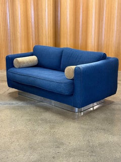 Mid century denim loveseat with chrome base