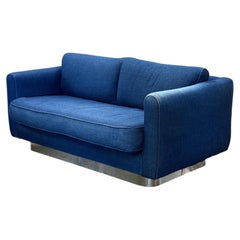 Mid century denim loveseat with chrome base