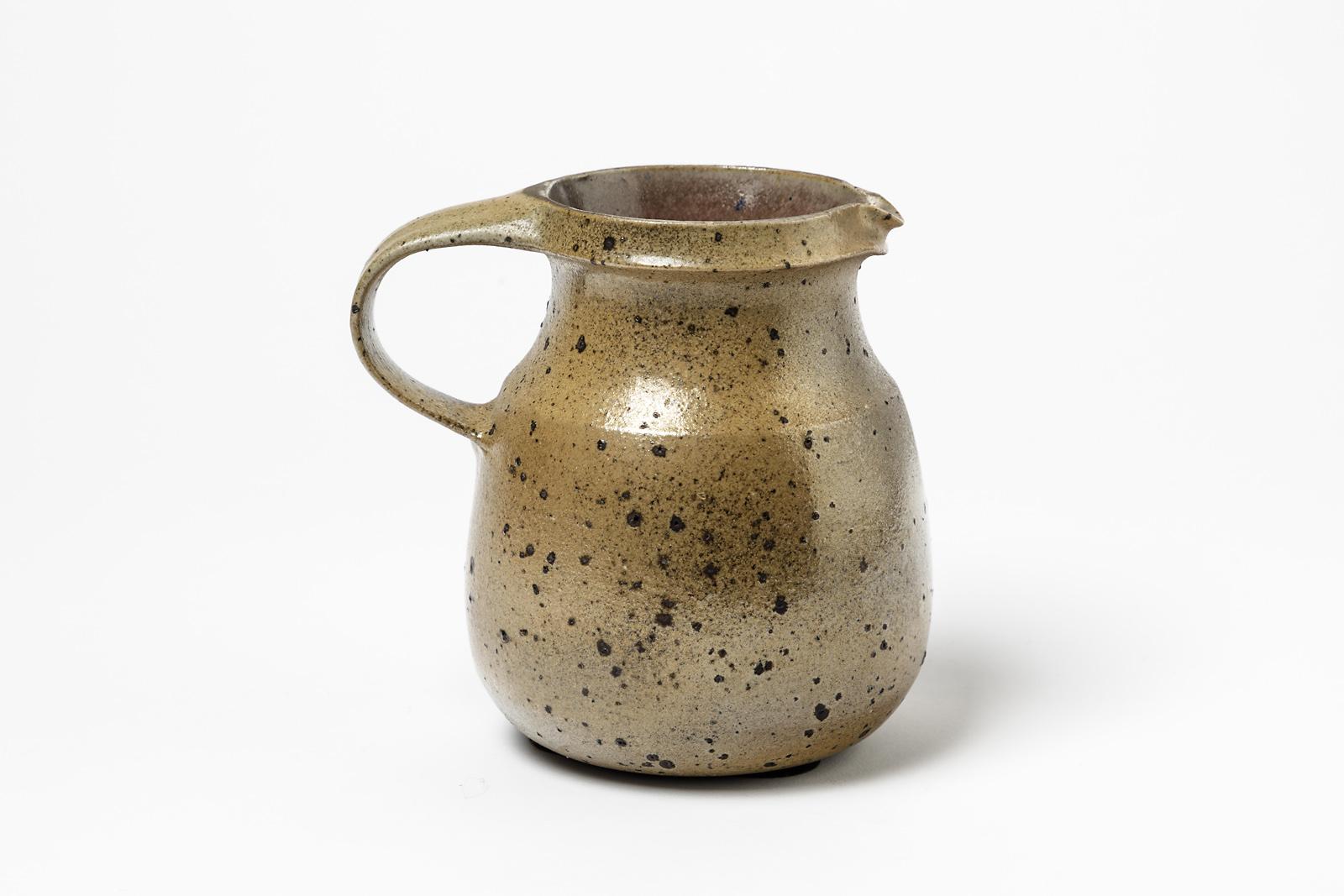 Robert Deblander (1924-2010)

Elegant stoneware ceramic pitcher by the French artist Robert Deblander

Realised circa 1970

Signed at the base and under the base

Original perfect conditions

Measures: Height 14cm, large 14cm.