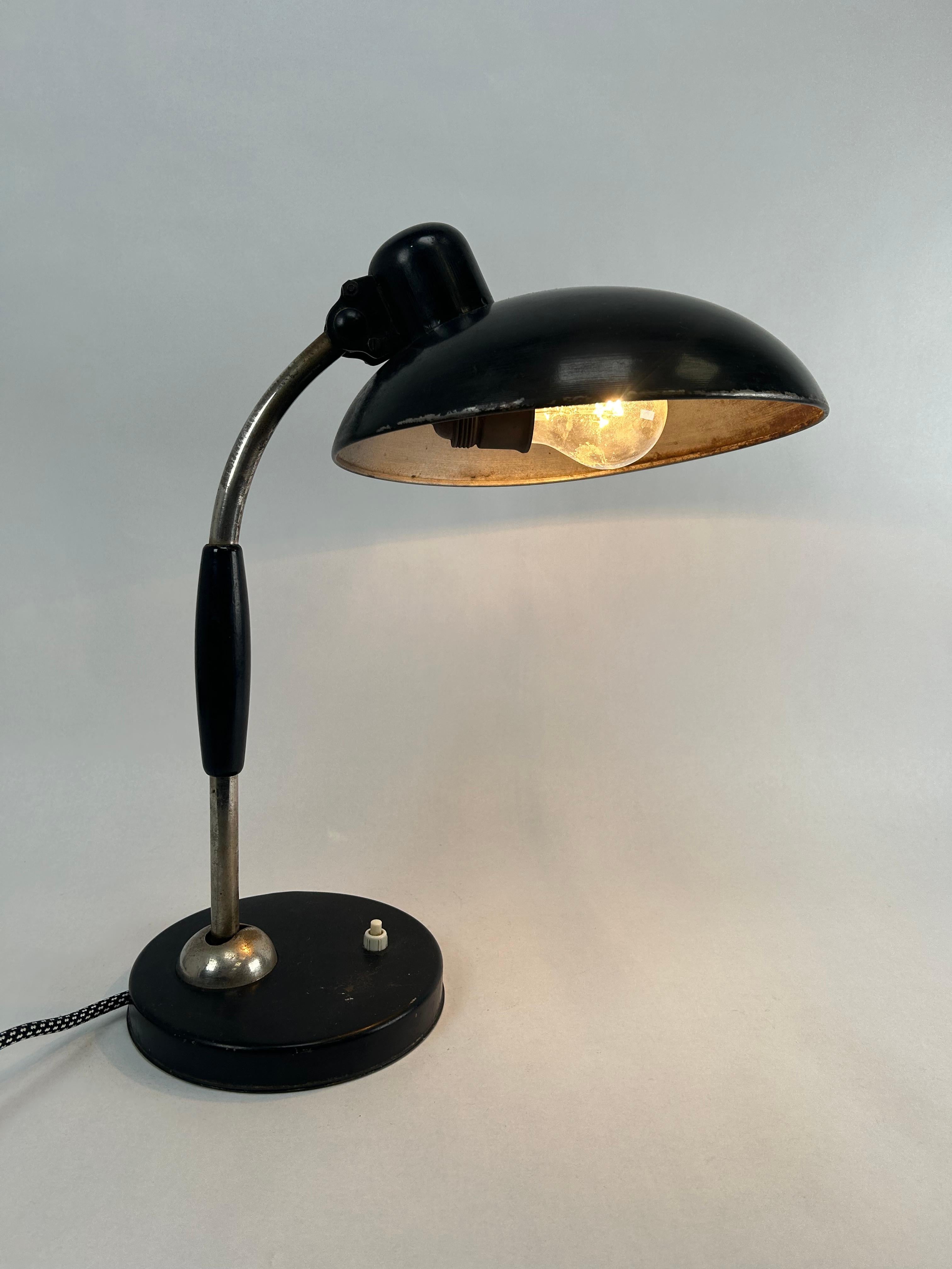 Mid-century design desk lamp by Christian Dell for Escolux Germany in original vintage condition with signs of use.