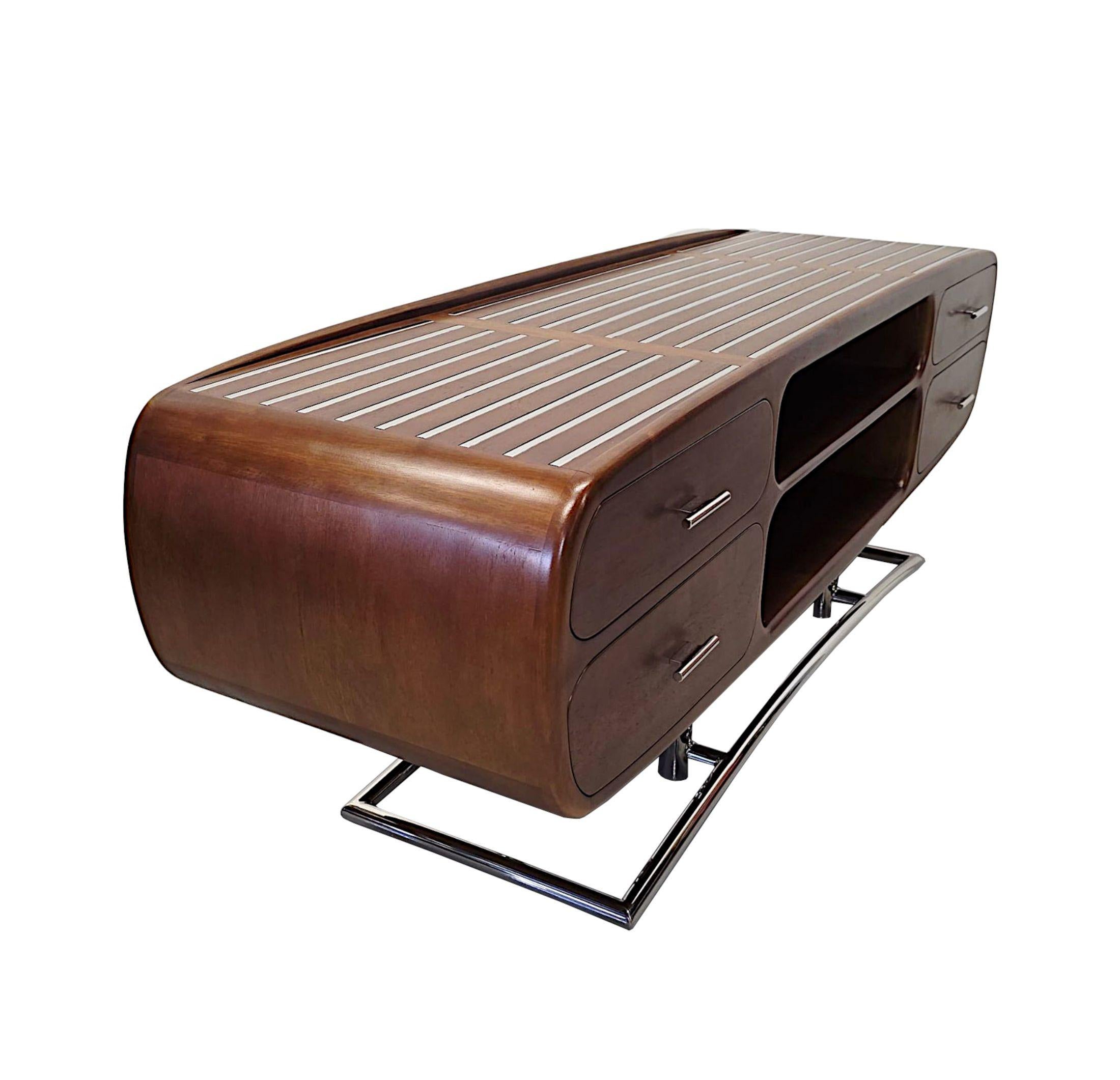 A fabulous Mid Century design hand made walnut and chrome side or television cabinet of exceptional quality with a clean curvilunear design and superb patination and grain to the wood.  The well figured moulded top of rectangular form with striking