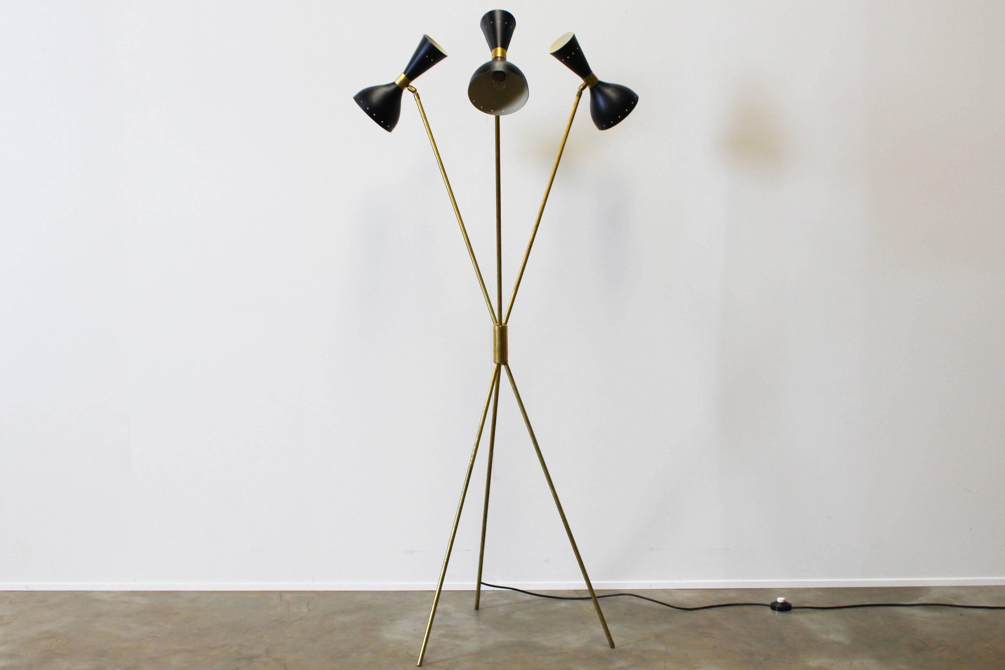Stunning midcentury design floor lamp in style 1950s Stilnovo. Wonderful minimalistic shape. The floor lamp has six-light sockets. The position of the shades can be fully adjust to your own wishes. Unique floor light that fits perfectly in any