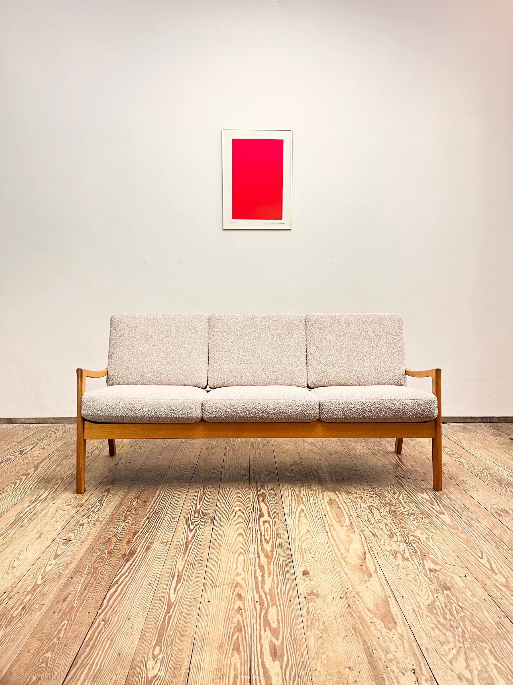 Dimensions: 182 x 75 x 80 cm (width x height x depth)

This mid-century three seat sofa was designed by Ole Wanscher for the Sentator Series for France and Son in the 1950s. This model is made out of solid oak wood and was manufactured by Poul