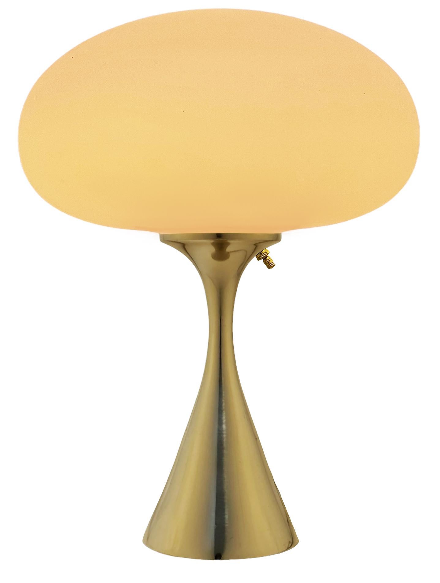 THIS ITEM IS ELIGIBLE FOR FREE SHIPPING!

A sleek stemlite table lamp made by Design Line. It features a cast aluminum main base in a conical form. The lamp base is finished in a classic polished chrome color. The frosted glass lamp shade is hand