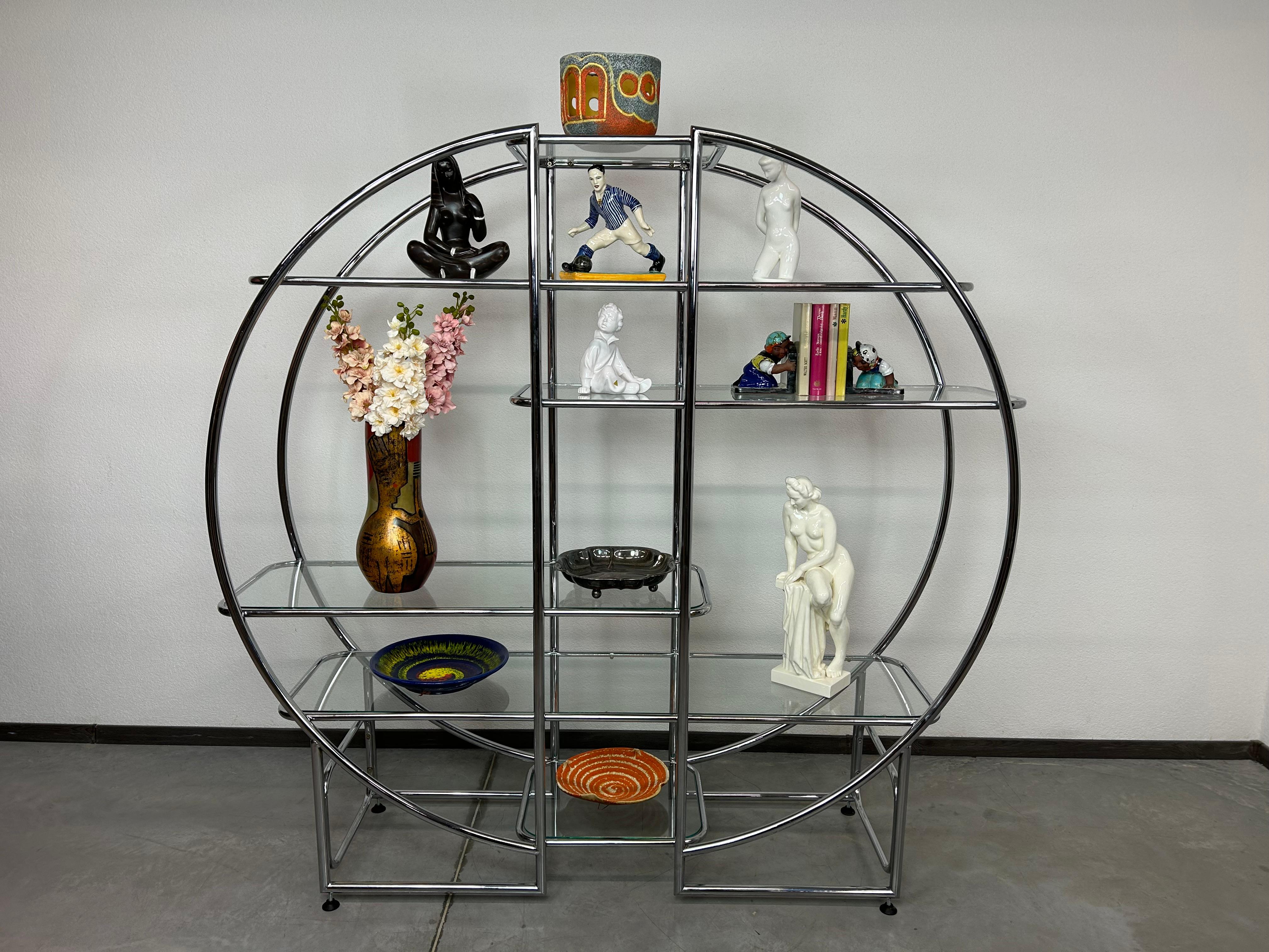 Mid-century design tubular steel etagere in very nice original condition with signs of use.