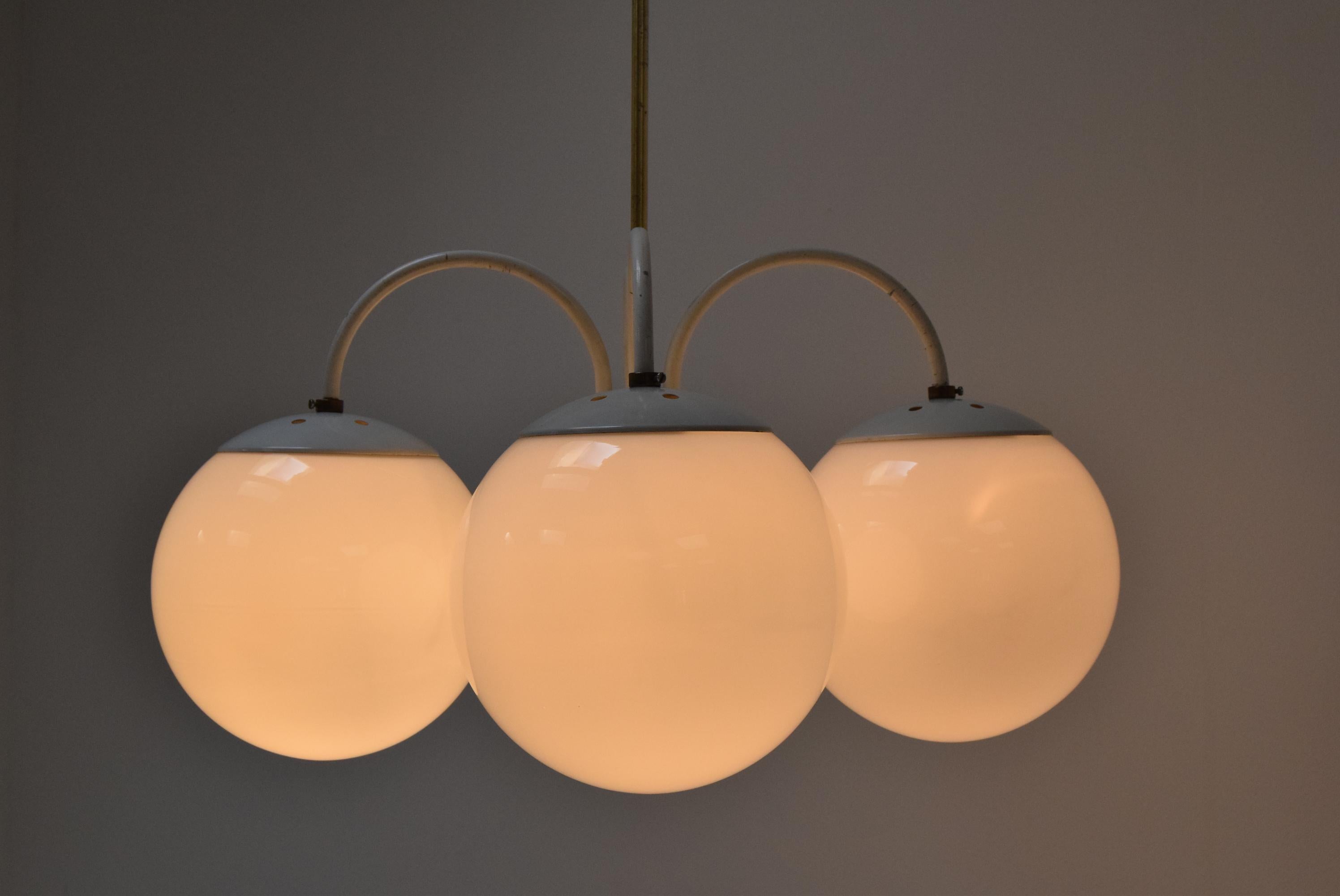 Made in Czechoslovakia
Made of milk glass, brass, lacquered Metal
4xE27 or E26 bulb
With aged patina
Re-polished 
Good original condition
US wiring compatible.