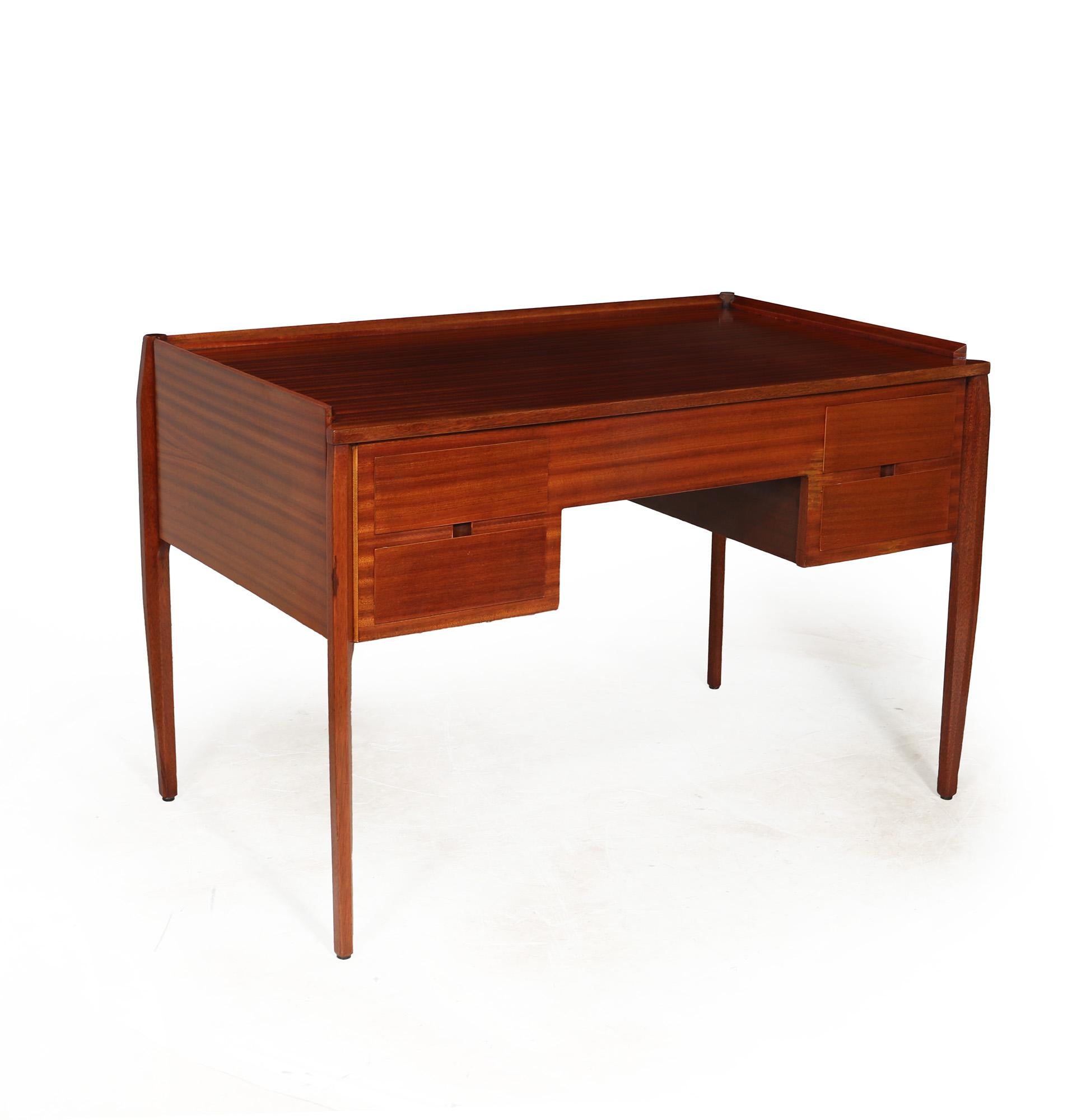 DESK BY GIO PONTI
A midcentury desk produced in Italy by Italian master Gio Ponti, good solid construction with Sapele veneer.Its sleek and minimalistic design is enhanced by elegantly shaped legs and a galleried top. Believed to have been created