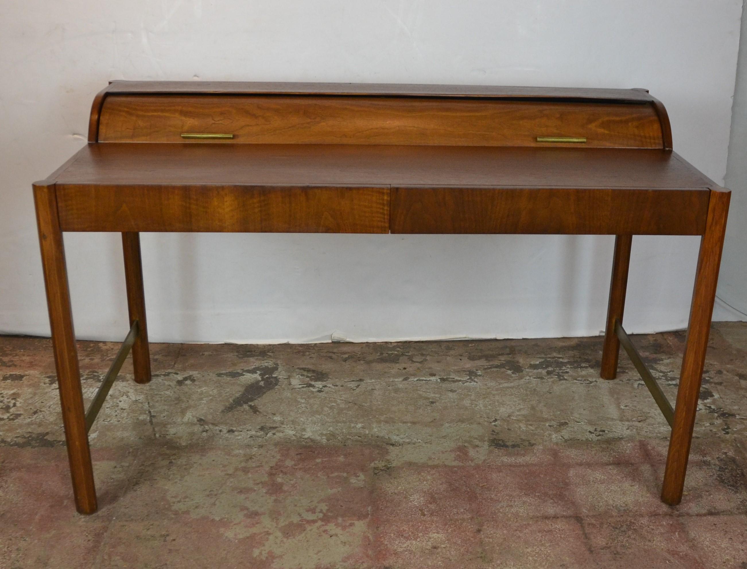 Mid-Century Modern roll-top desk by the Hekman Furniture Company of Grand Rapids, Michigan. Hekman Furniture was funded in 1922 and become part of the Howard Miller Company in 1983. The company is still in business but this desk from the 1960s is