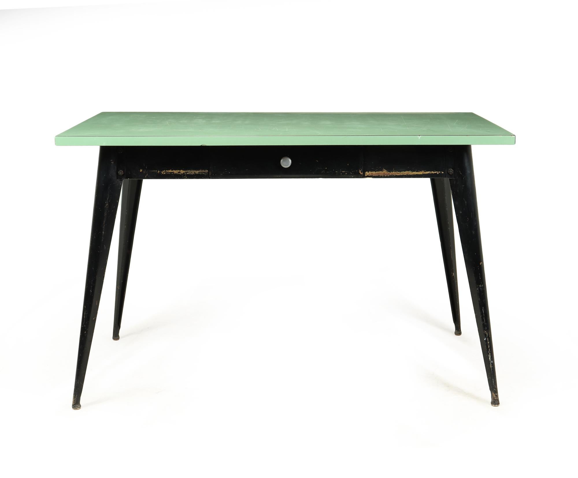A rare original T55 Desk designed by Xavier Pauchard for Tolix produced in France in the 1950’s, this example has green melamine top on black painted steel base with single drawer, the desk is in very good condition throughout with wear and age