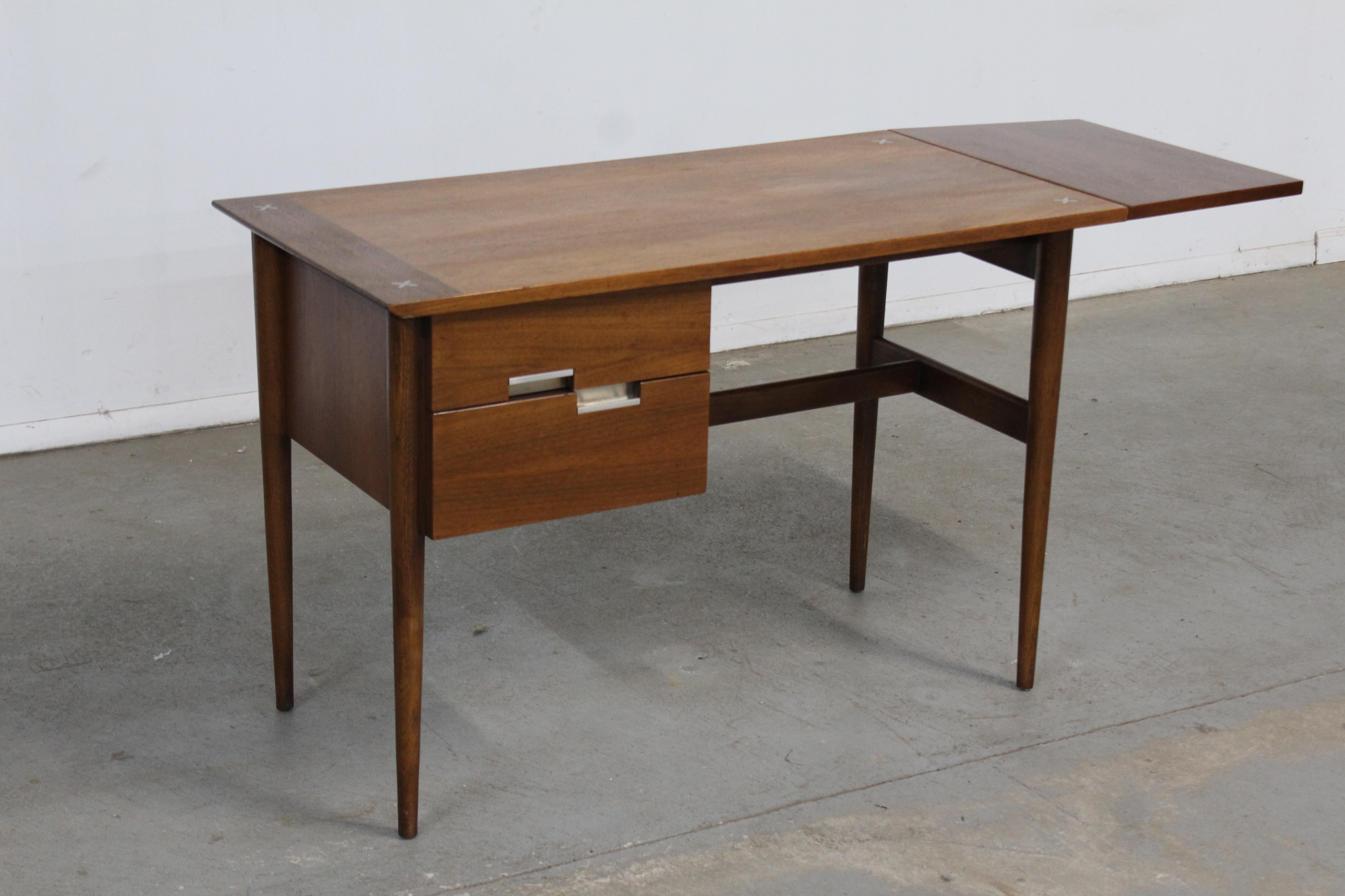 Midcentury desk Danish Modern Meron Gershun walnut drop side desk.

Offered is a very cool midcentury desk Danish Modern Meron Gershun walnut drop side desk. The desk was made by American of Martinsville and is signed. This desk is straight out of