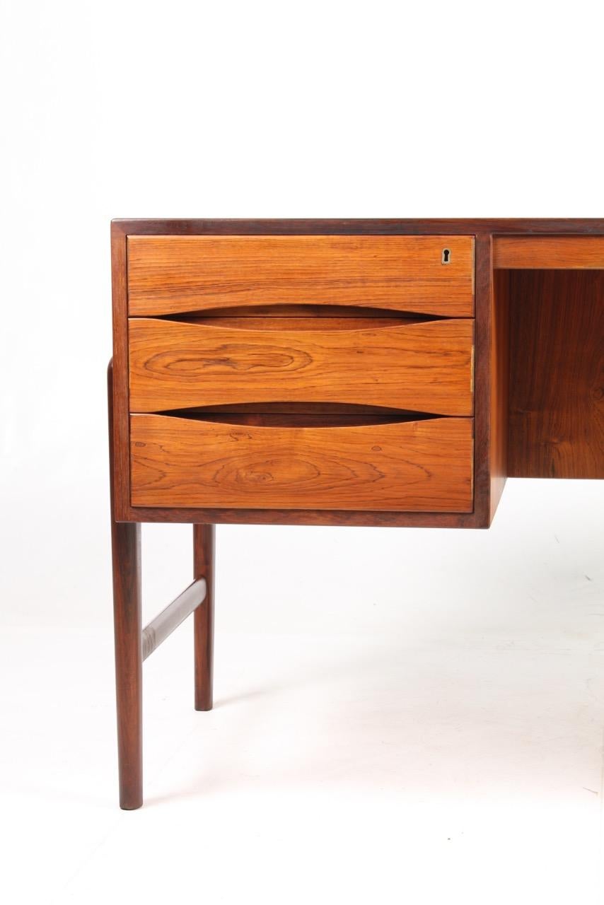 Freestanding desk in rosewood designed and made in Denmark in the 1960s. Great condition.