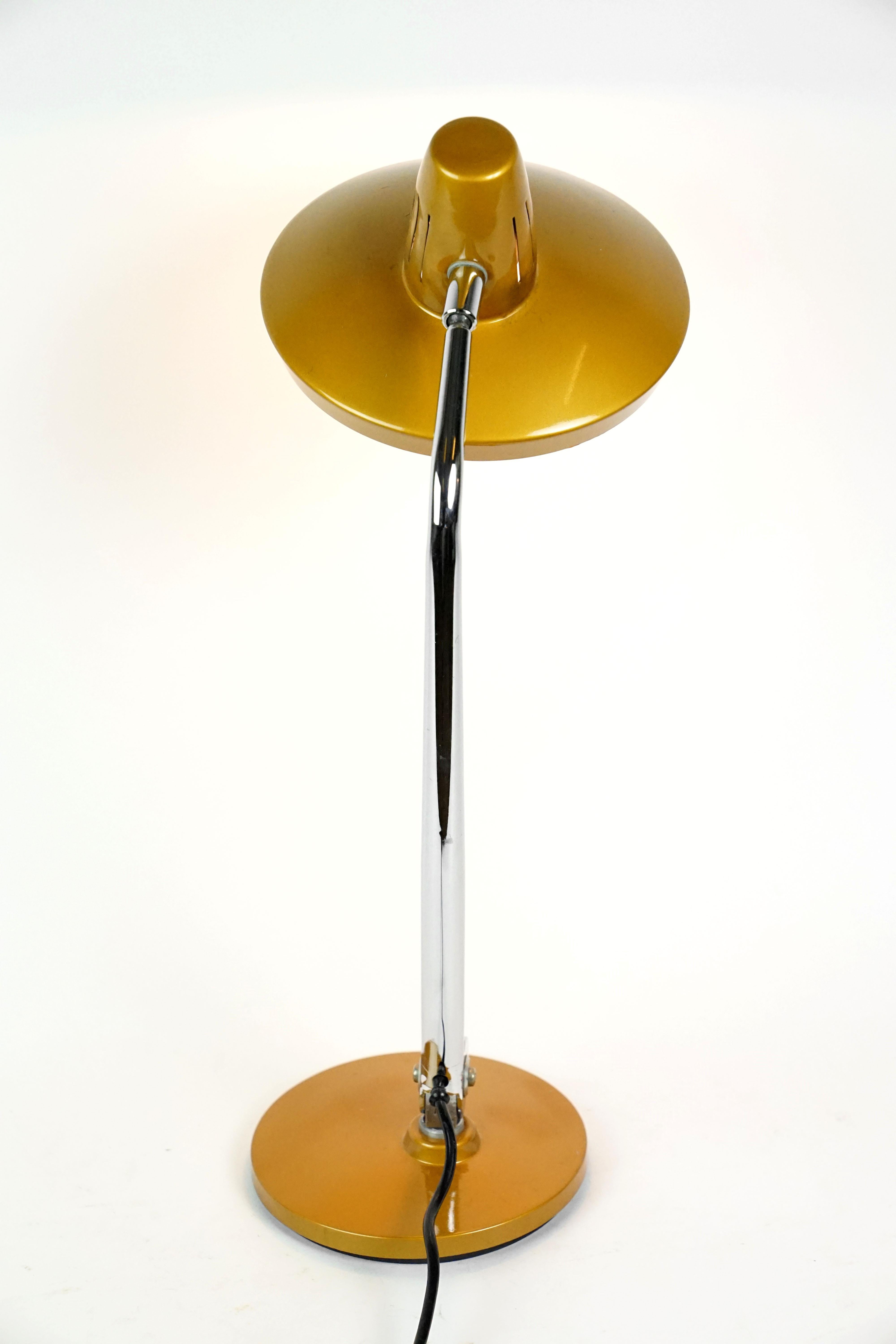 Copper colored table lamp by Fase Madrid, Spain in the 1960s.
The lamp is adjustable. One bulb E27 (max. 60W) working for wired Austrian application. 
Original copper lacquer finish.
