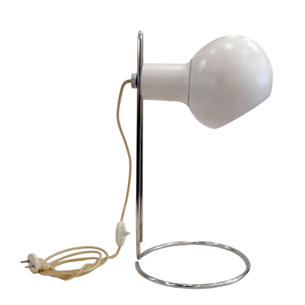 An elegant  Mid-Century Modern table lamp displaying the timelessness and modern engineering  craft and rationality.