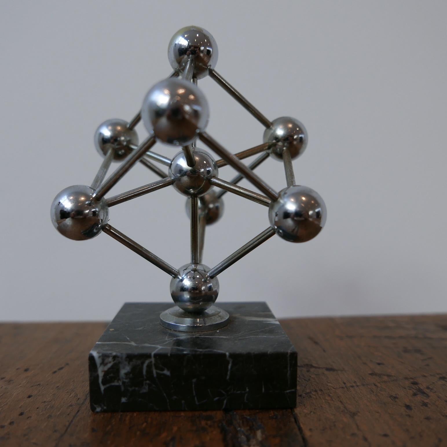 A small desk top model of the Atomium building in Brussels.

Marble base, metal model.

Belgium, c1960s.

Some small nicks and scuffs, wear commensurate with age.

Location: London Gallery.

Dimensions: 12 H x 8.5 W x 9.5 D in cm.

Delivery: POA

We