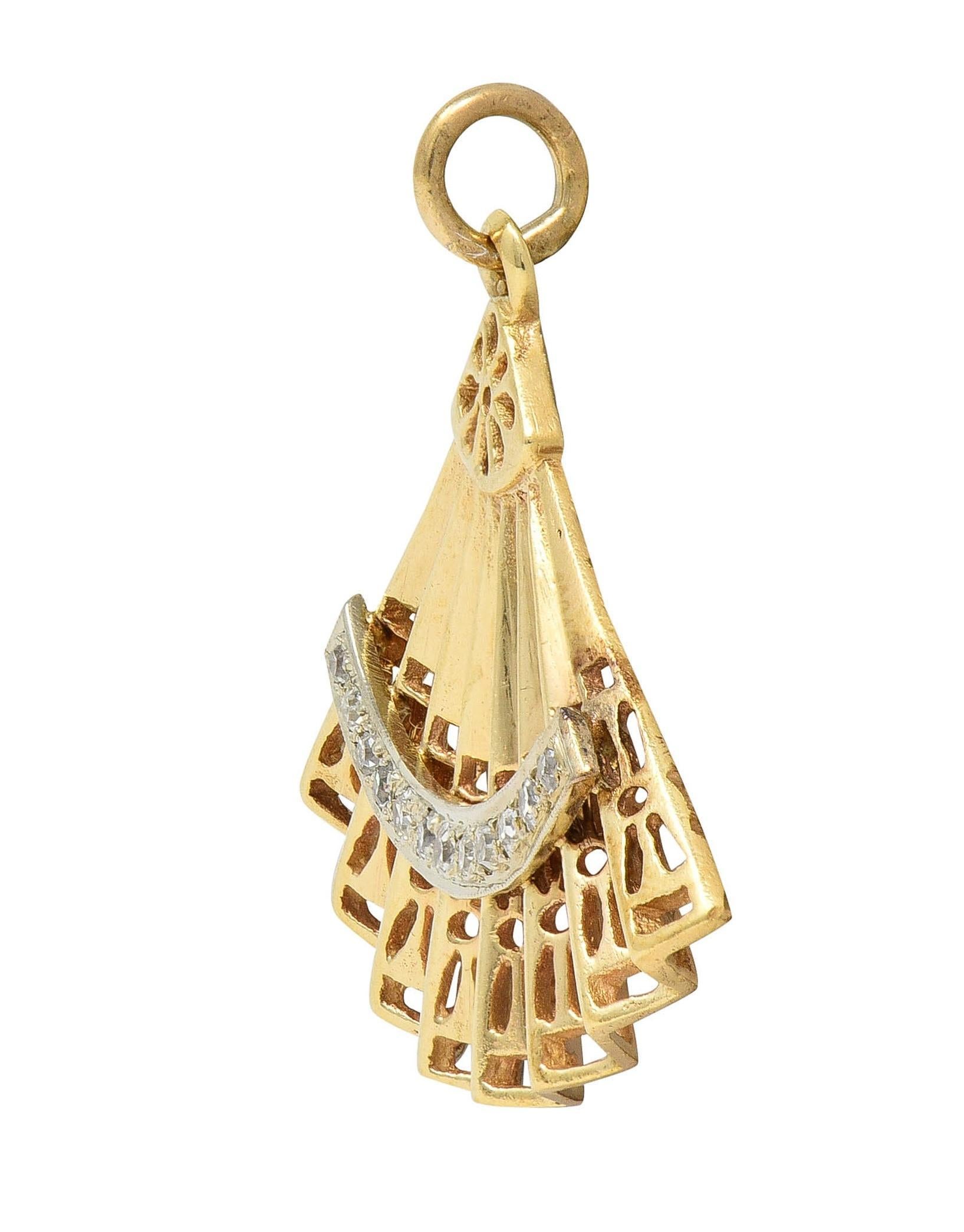 Designed as a pleated yellow gold hand fan featuring a row of diamonds
Single cut and bead set in a raised and curving white gold appliqué
Weighing approximately 0.12 carat total - eye clean and white
Fan is pierced with floral and geometric