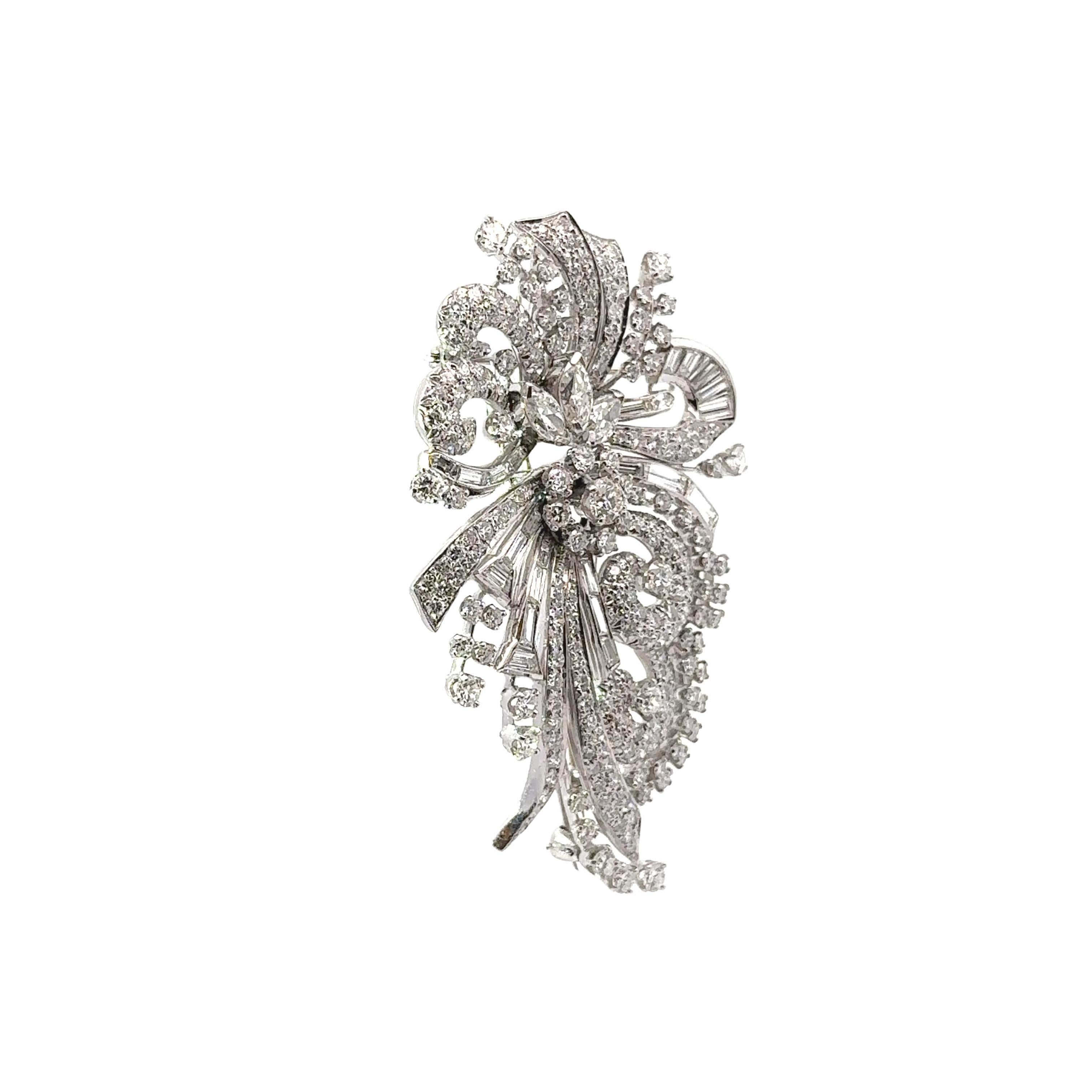 A lovely treasure from the middle of the 1900’s features approximately 21.40 carats of mixed-cut white diamonds. The diamonds exhibit a captivating brilliance and sparkle that radiate across the brooch. The intricate design showcases a dynamic