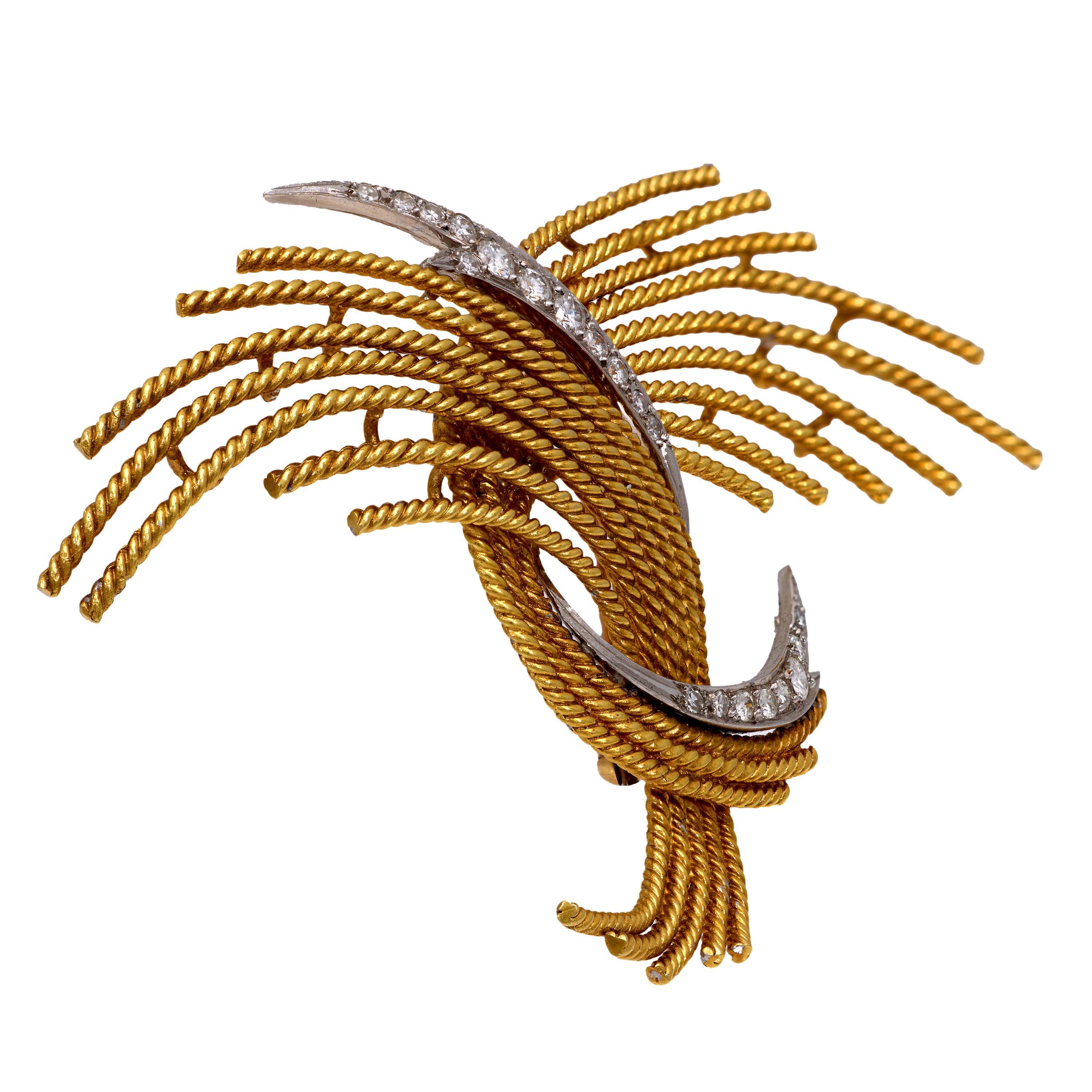 This Mid Century brooch from the 1950s is crafted in 18k yellow and white gold and features twenty round brilliant and single cut diamonds totaling approximately 0.40 carats, graded G color and VS clarity. The sculptural design reflects the elegance