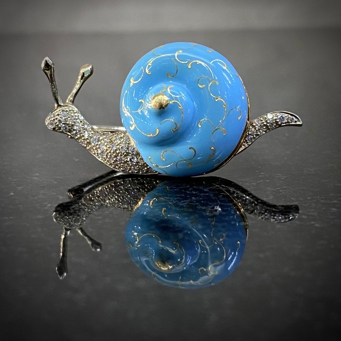 Mid-Century diamond and turquoise-blue enamel snail brooch in 19.2kt yellow and white gold, Portugal, circa 1960. The shell displaying a beautiful sky-blue color resembling the renowned “Tiffany blue” and accented with yellow gold scrolled motifs,