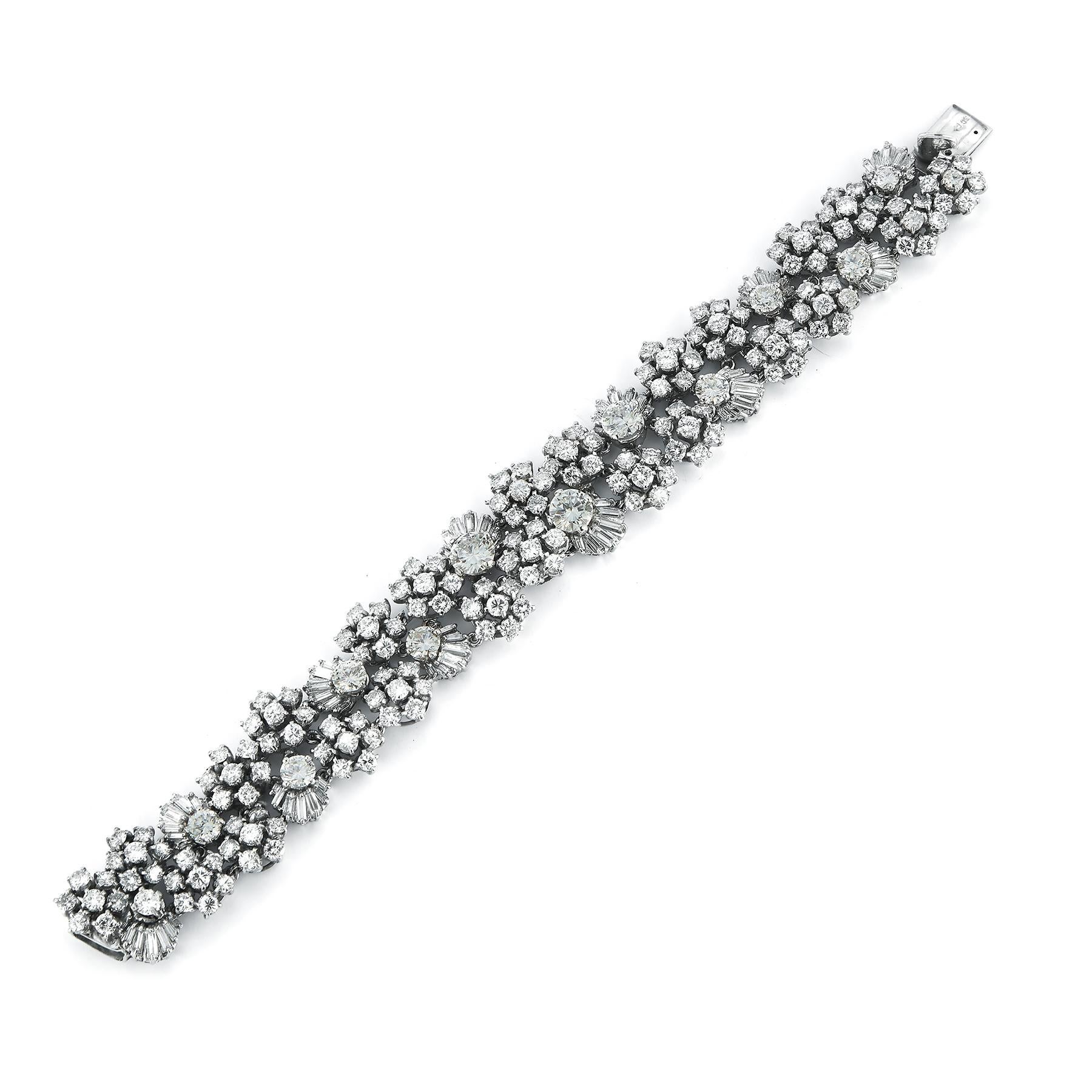 Fancy Round Cut Diamond Bracelet 
Brilliantly crafted rows and floral patterns consisting of multi-size round and brilliant cut diamonds complete this sparkling bracelet
168 Small Round-Cut Stones, 9 Medium Round-Cut Stones, 3 Large Round Stones and