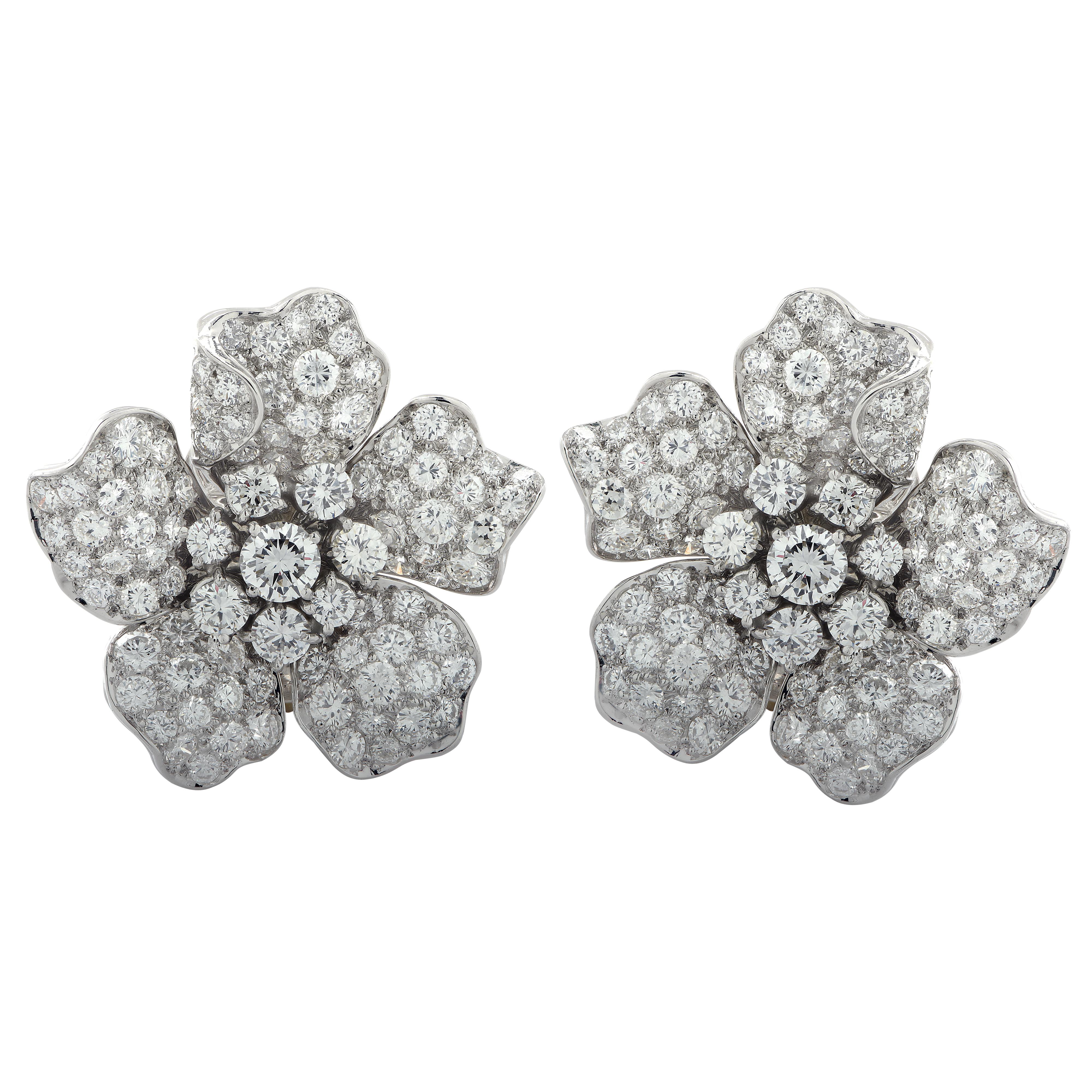 Glorious mid-century flower earrings crafted in platinum, featuring 182 round brilliant cut diamonds weighing approximately 10 carats total, G color, VS clarity. Finely crafted diamond encrusted petals are delicately arranged around diamond centers
