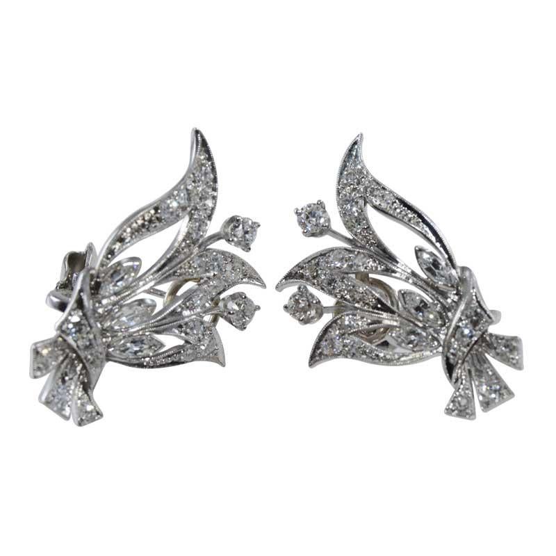 
STYLE / REFERENCE: Mid Century Earrings
STONES / WEIGHT: Round and Marquise shaped Diamonds, 1.80cts total weight
COLOR / CLARITY E/F Color VS Clarity
METAL / MATERIAL: Palladium
CIRCA / YEAR: 1940's

During WW2 there was a moratorium on platinum