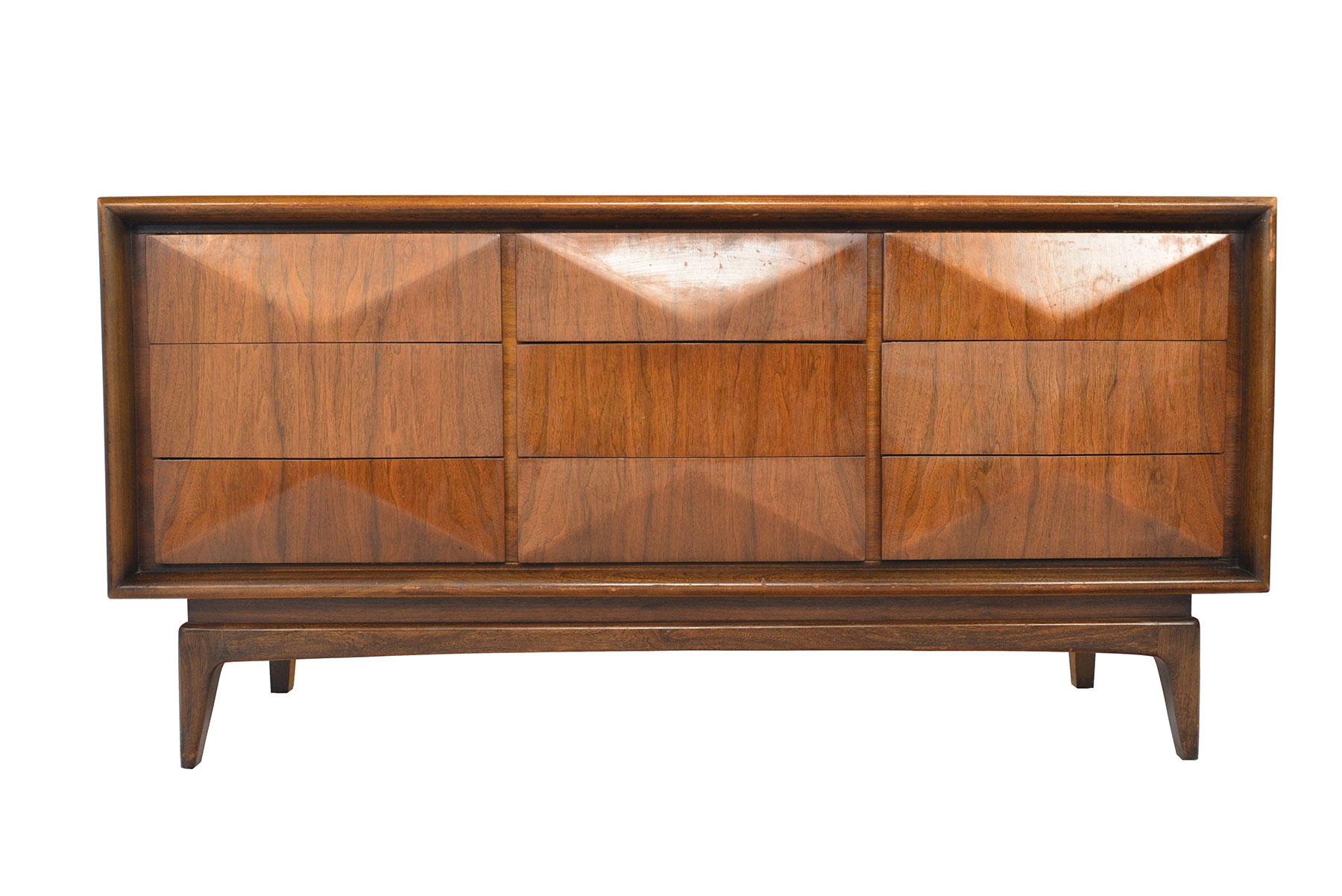 This low midcentury dresser was designed by United in the 1960s. Drawers feature a three- dimensional sculpted diamond design. In excellent original condition.
  