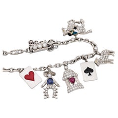 Bracelet à breloques en diamant, pierres précieuses, émail et platine du milieu du siècle dernier