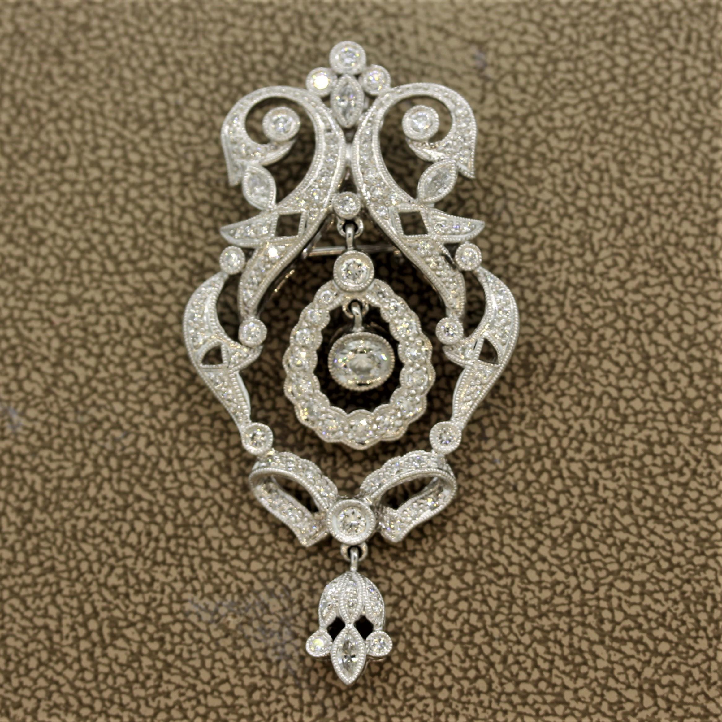 A true mid-century treasure, circa 1960, featuring 1.44 carats of round brilliant and marquise shaped diamonds. They are set around beautifully worked filigree and millgrain settings. The center drop has a diamond dangle in the center along with a