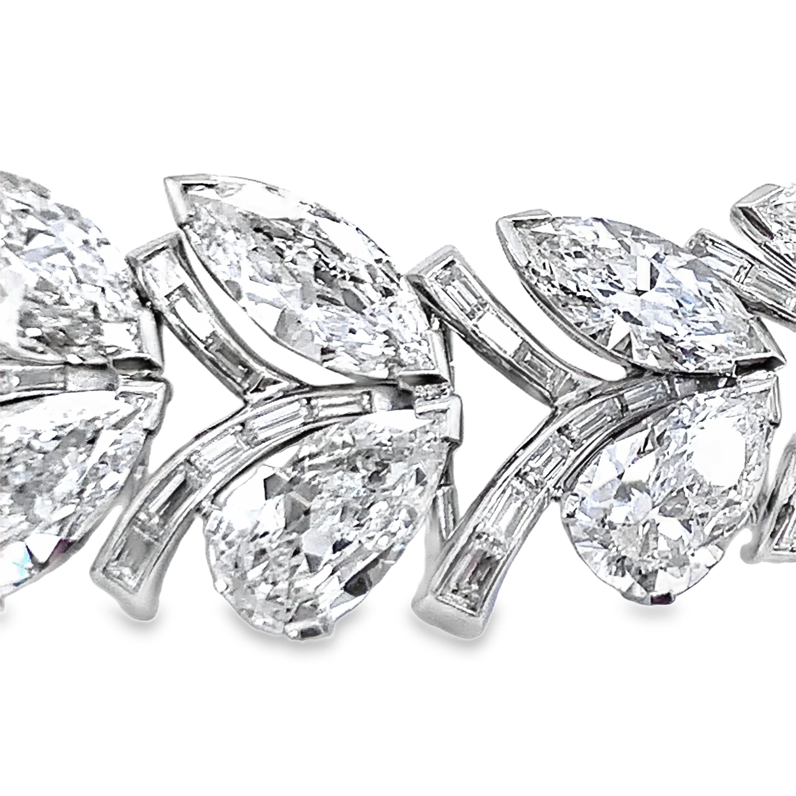 This spectacular mid-century platinum necklace is a true masterpiece, showcasing 324 marquise, pear, and straight baguette diamonds with an approximate total weight of 48 carats, graded H-I-J color and VS-2, SI-1 clarity. Eighteen of the stones,