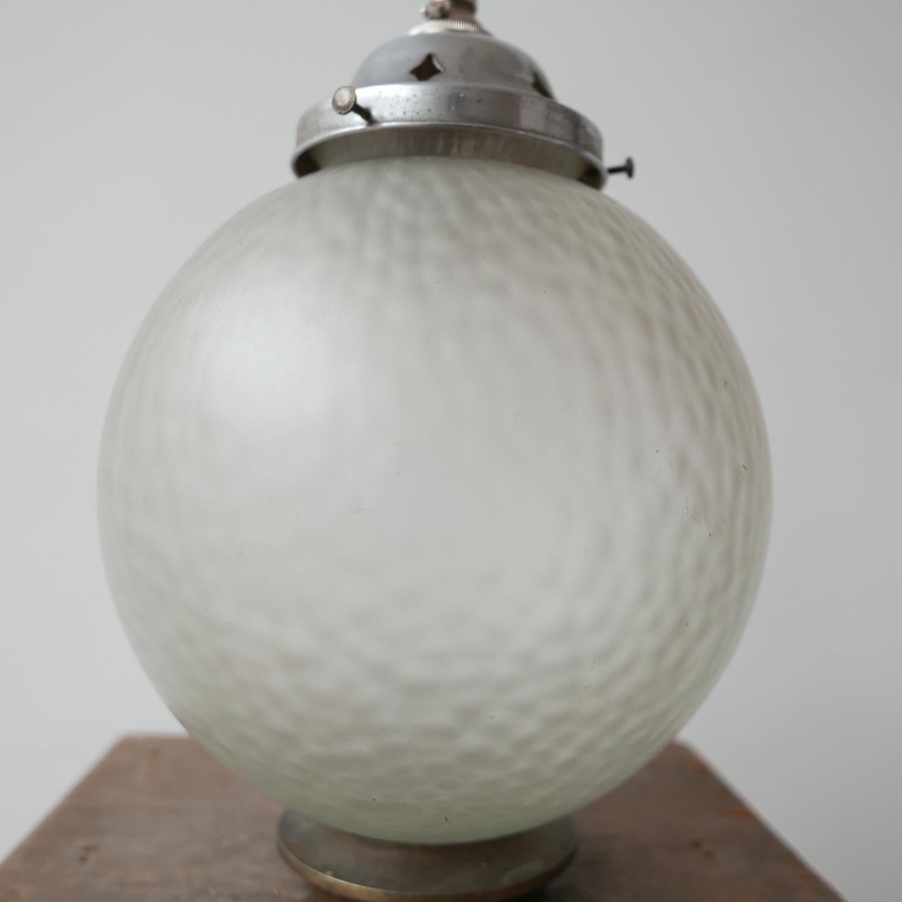 An elegant diffused glass pedant light. 

Germany, c1950s. 

Since re-wired with a hook provided. 

Metal gallery. 

Good condition. 

Dimensions: 21 Diameter x 28 Height in cm.

Delivery: POA.

 