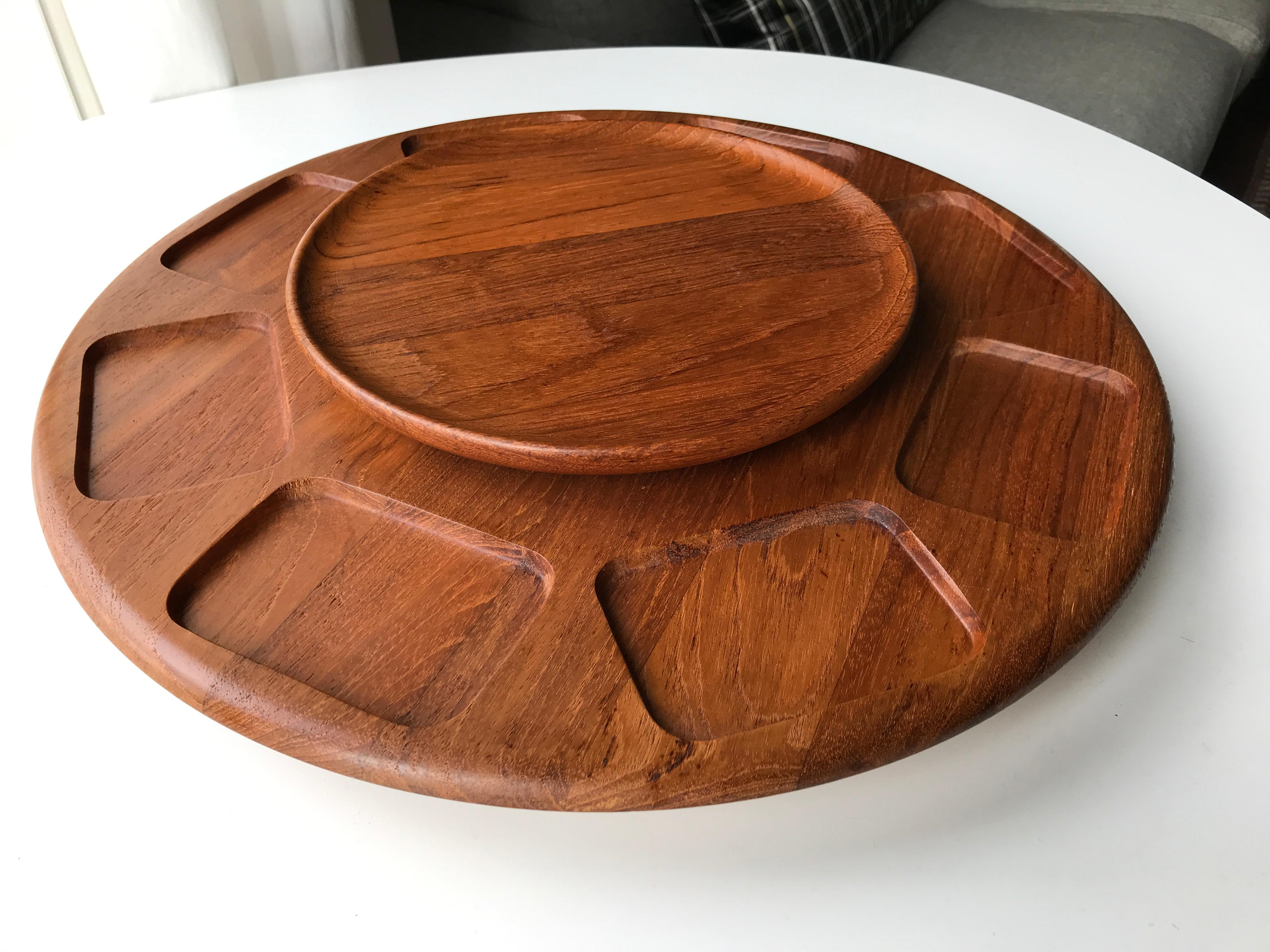 Mid-Century Low two-tier Lazy Susan in solid teak made by Digsmed Woodcarving, Denmark, early 1960s. Soft rounded edges. Eight carved rooms plus circular top shelf. Base and top plate are connected and remains stationary while the middle plate can