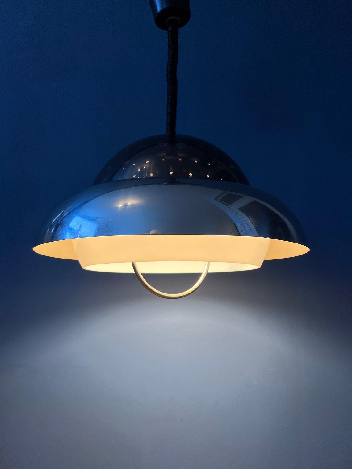 Dijkstra space age pendant lamp with acrylic glass 'dome' and chrome outer layer. The lamp has an acrylic glass outer shade and an aluminium inner shade. Together they create a magnificent space age-effect. The lamp requires one E27/26