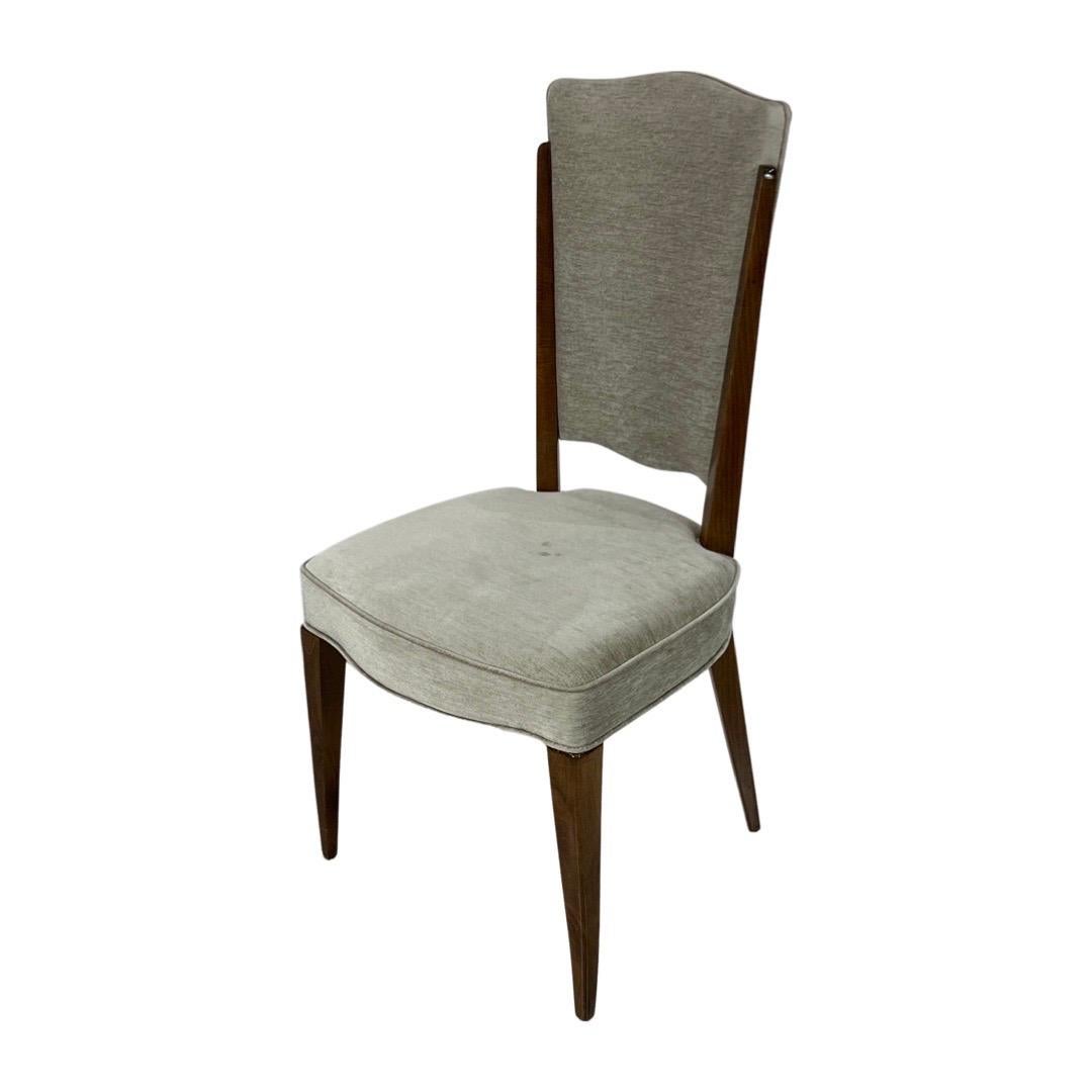 Midcentury dining chairs set (8 chairs) upholstered in a light grey velvet framed in walnut wood.
Made in France.

Measures: 39.50